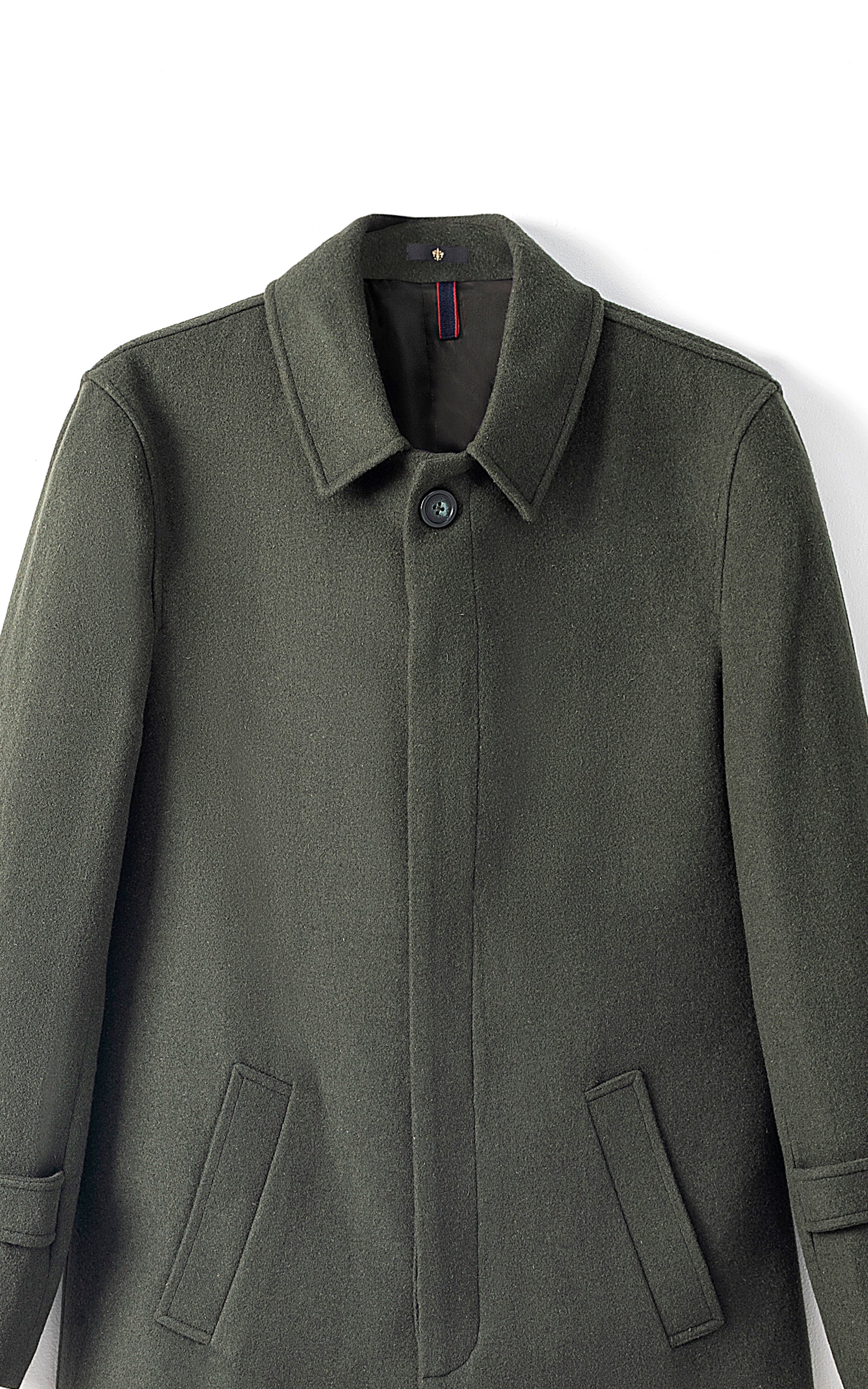 Light olive long coat close-up of notched collar, button placket, and welt pockets