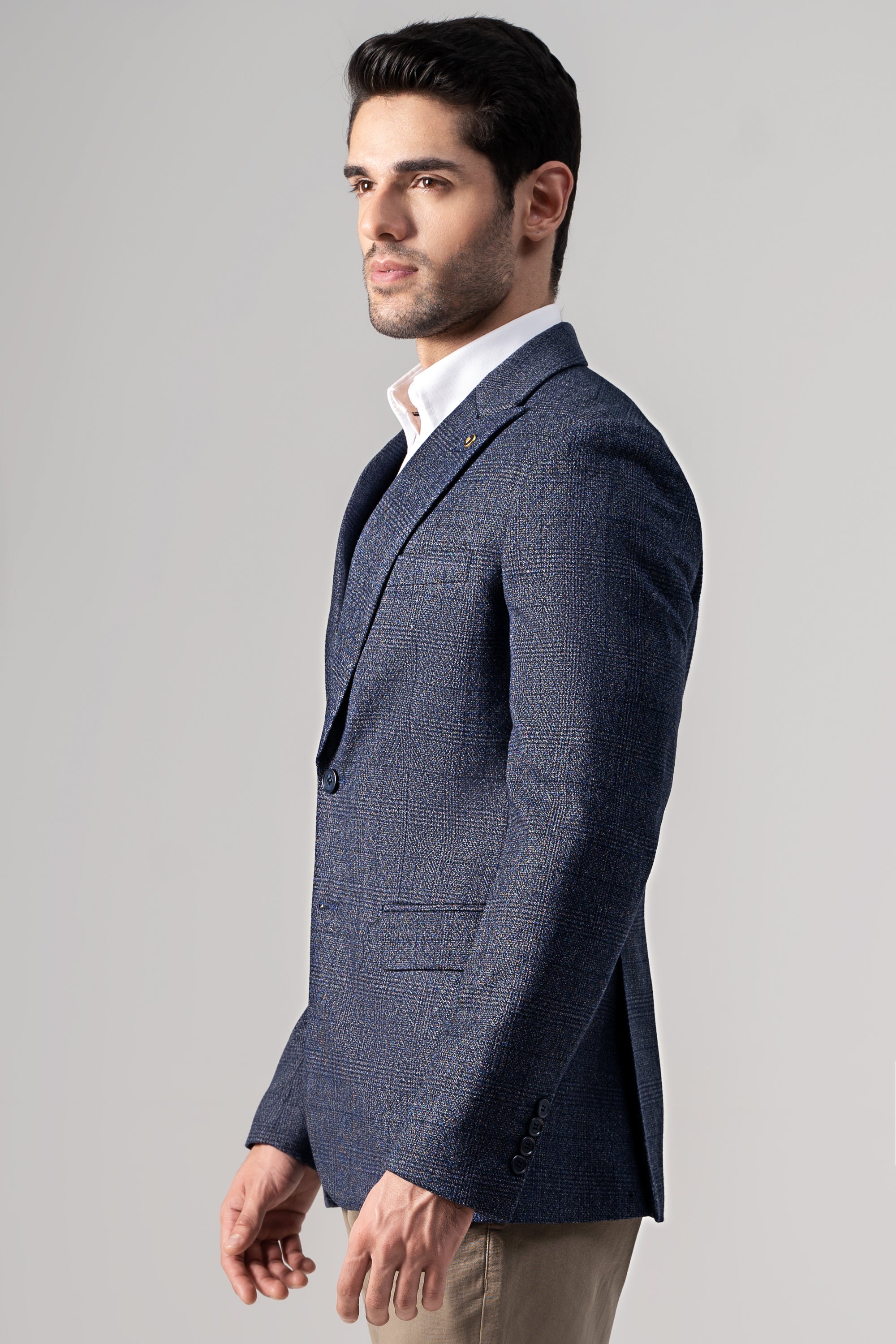 Men's side-view casual coat in dark navy textured fabric with notched lapel and chest pocket