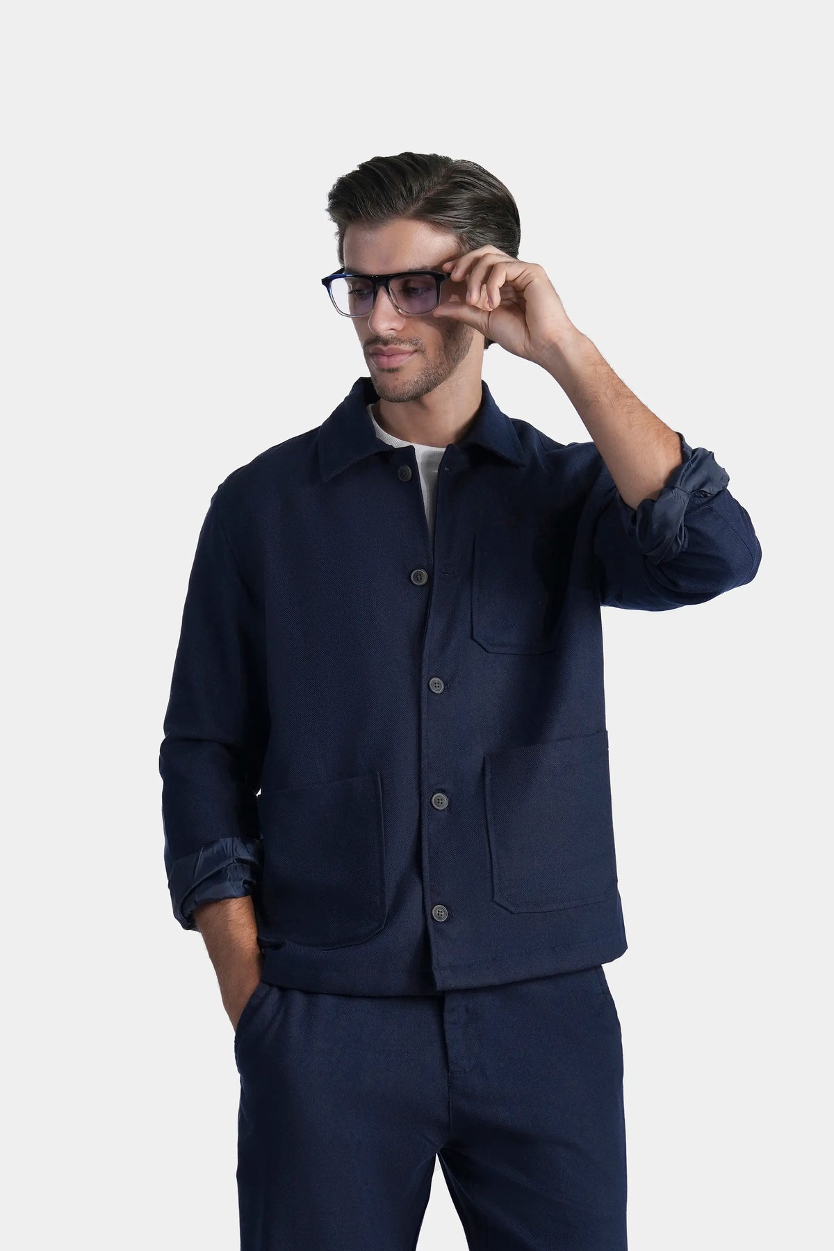 Front view navy shacket with stand collar, button front and chest pocket