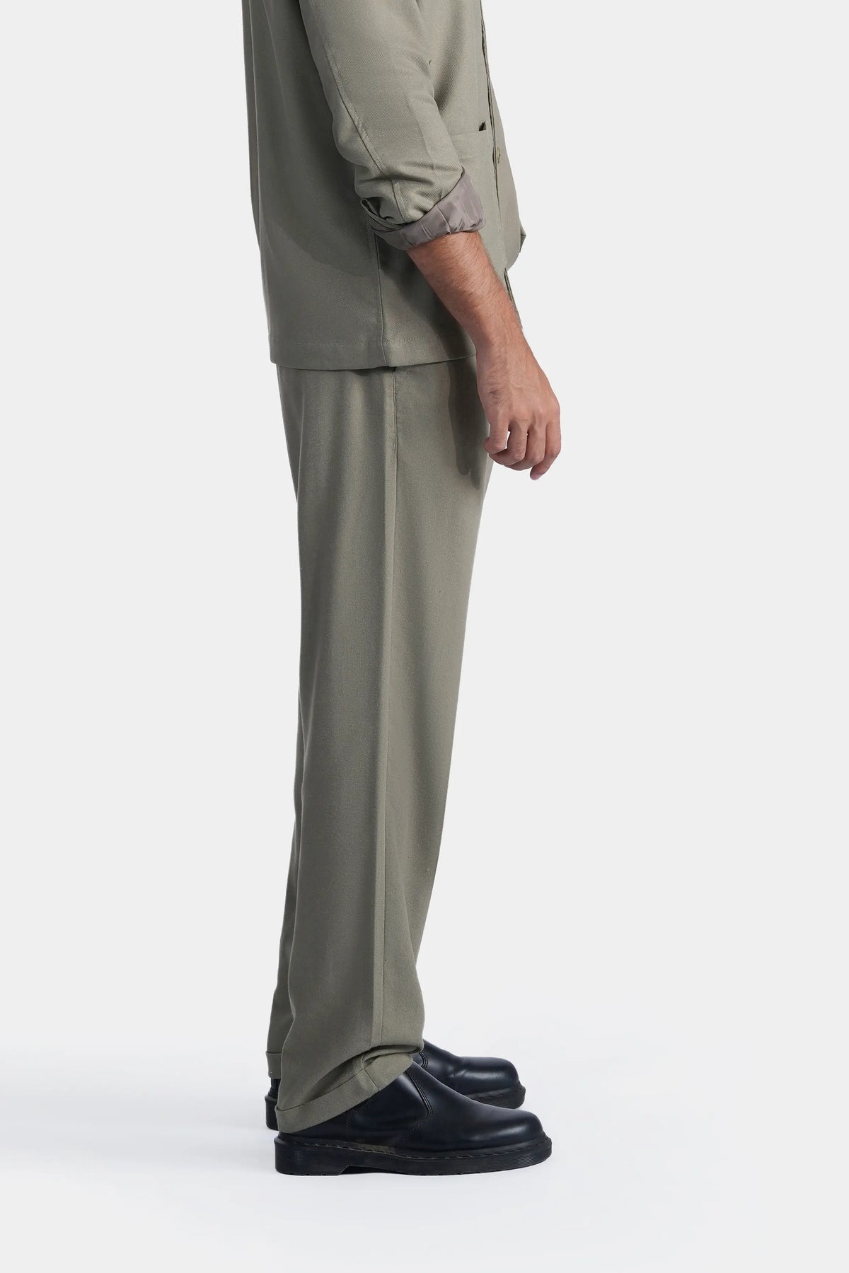 Light olive straight-fit trousers in side profile, full-length leg