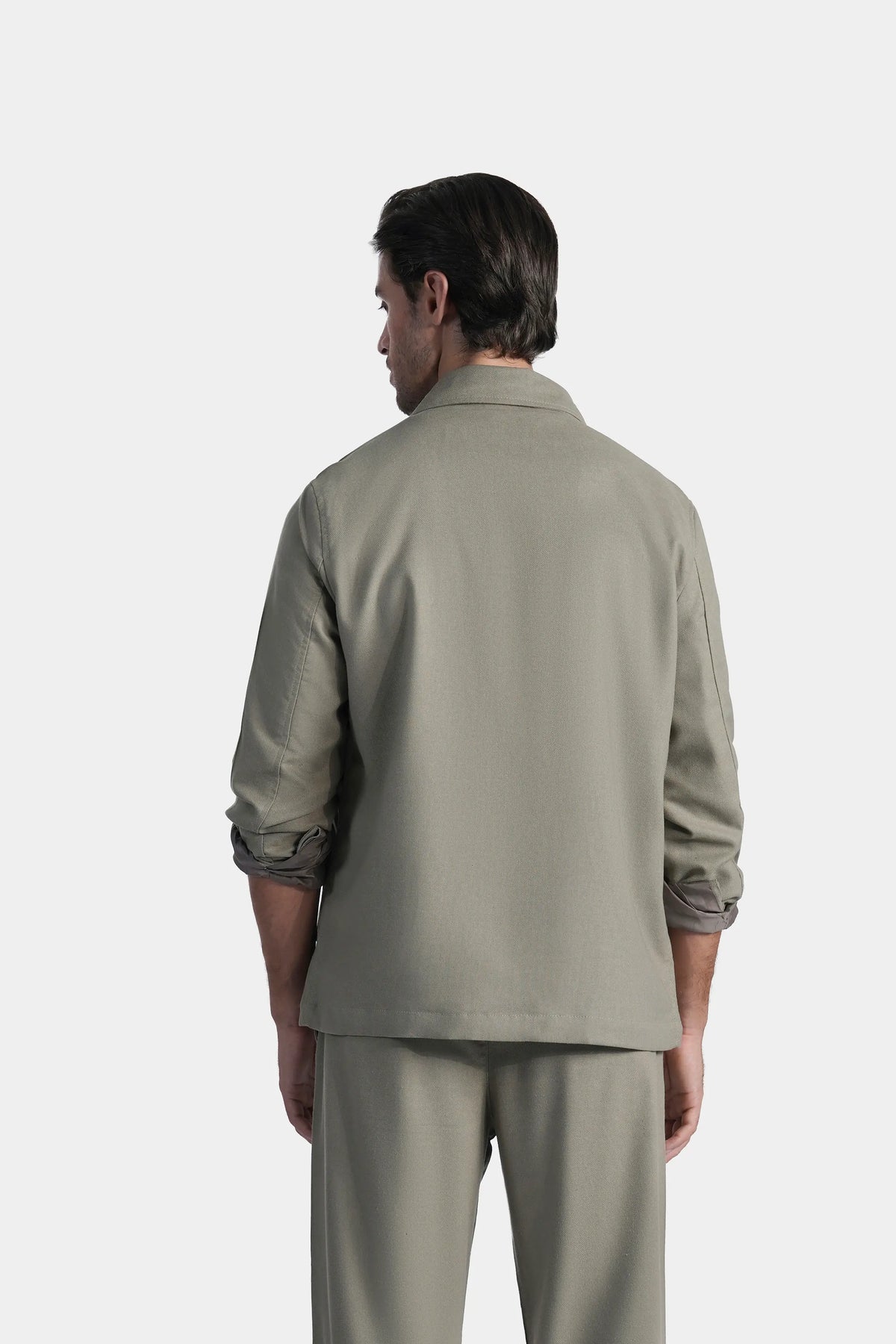 Olive shacket back view with full sleeves and yoke seams