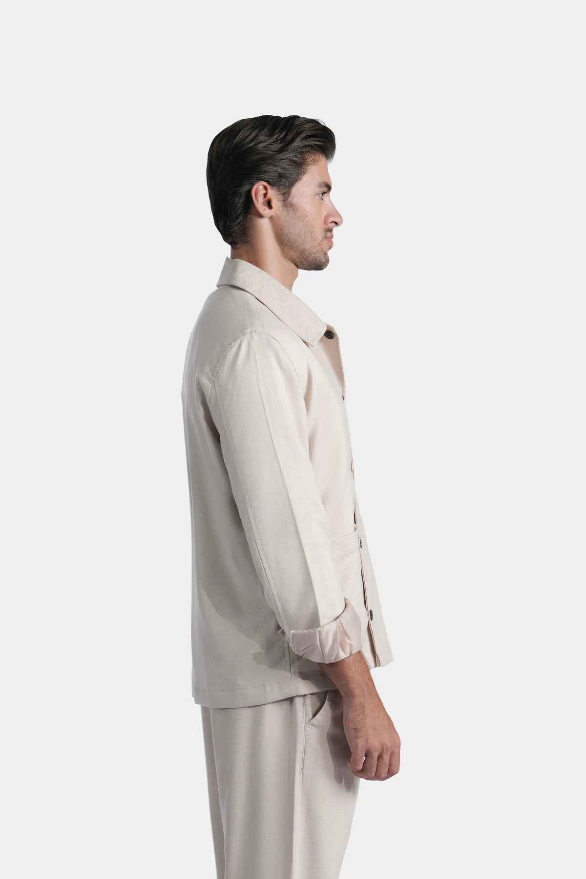Men's khaki shacket side view with stand collar and full button-front sleeves