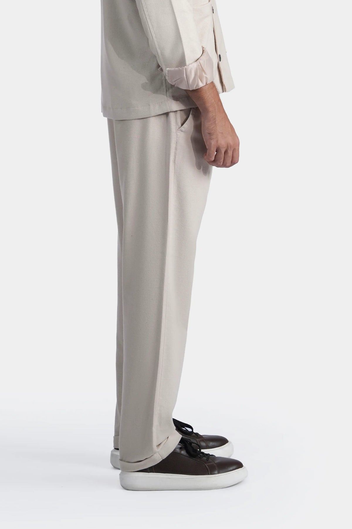 Light khaki straight trousers with crease line and visible side seam