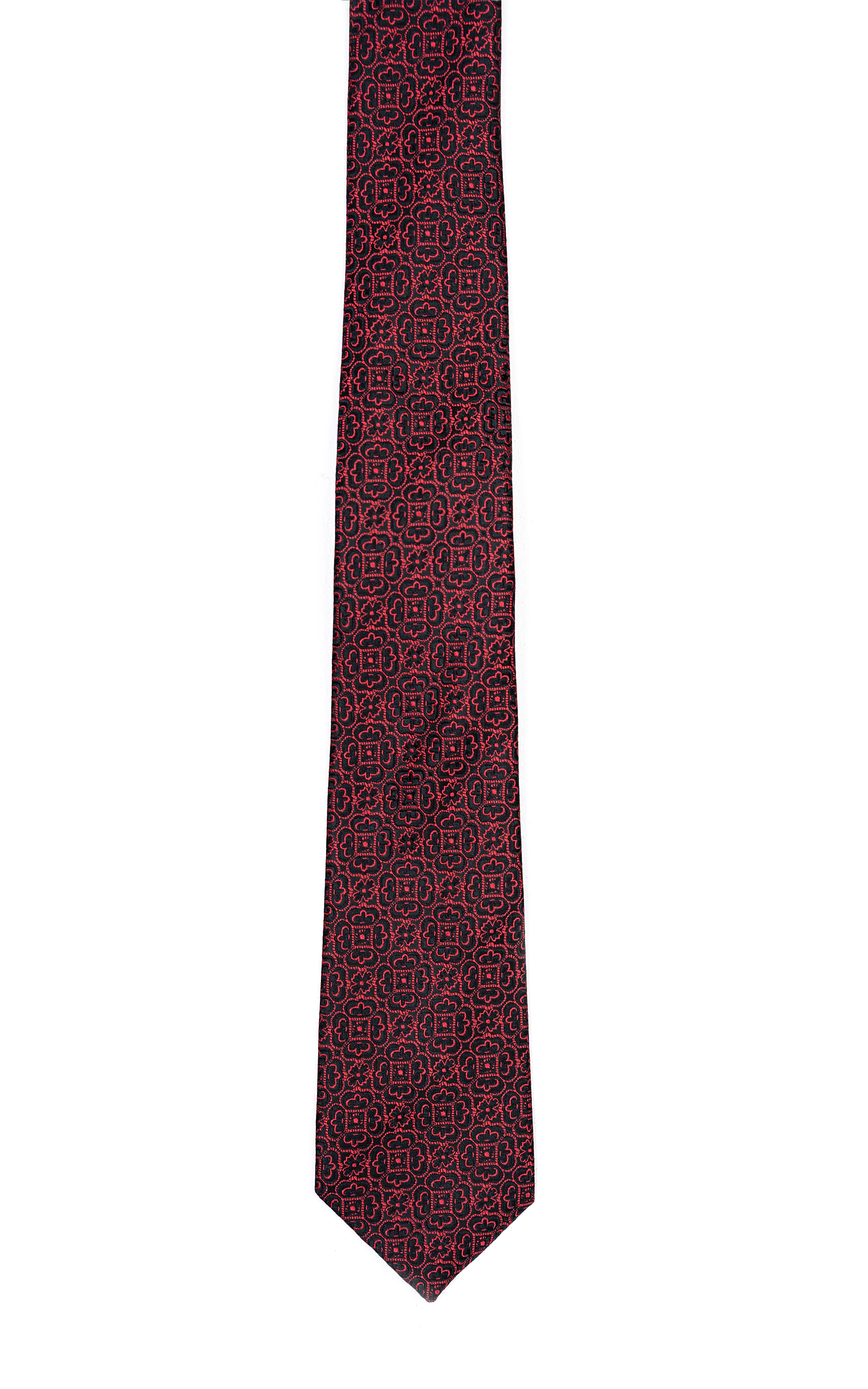 Burgundy poly silk tie with dark geometric repeating pattern, pointed tip