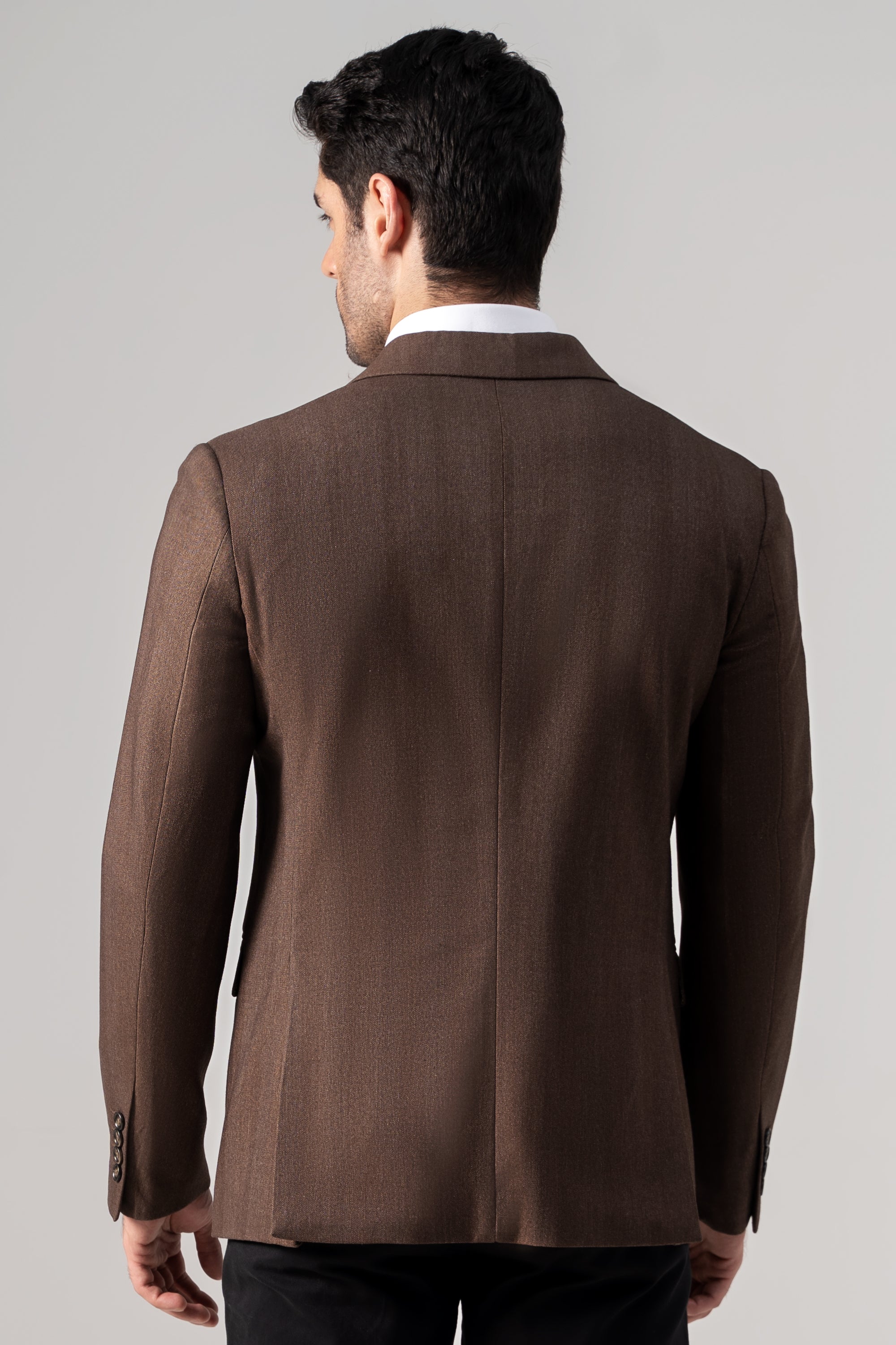 Brown casual coat back view with center vent and single-breasted button detail