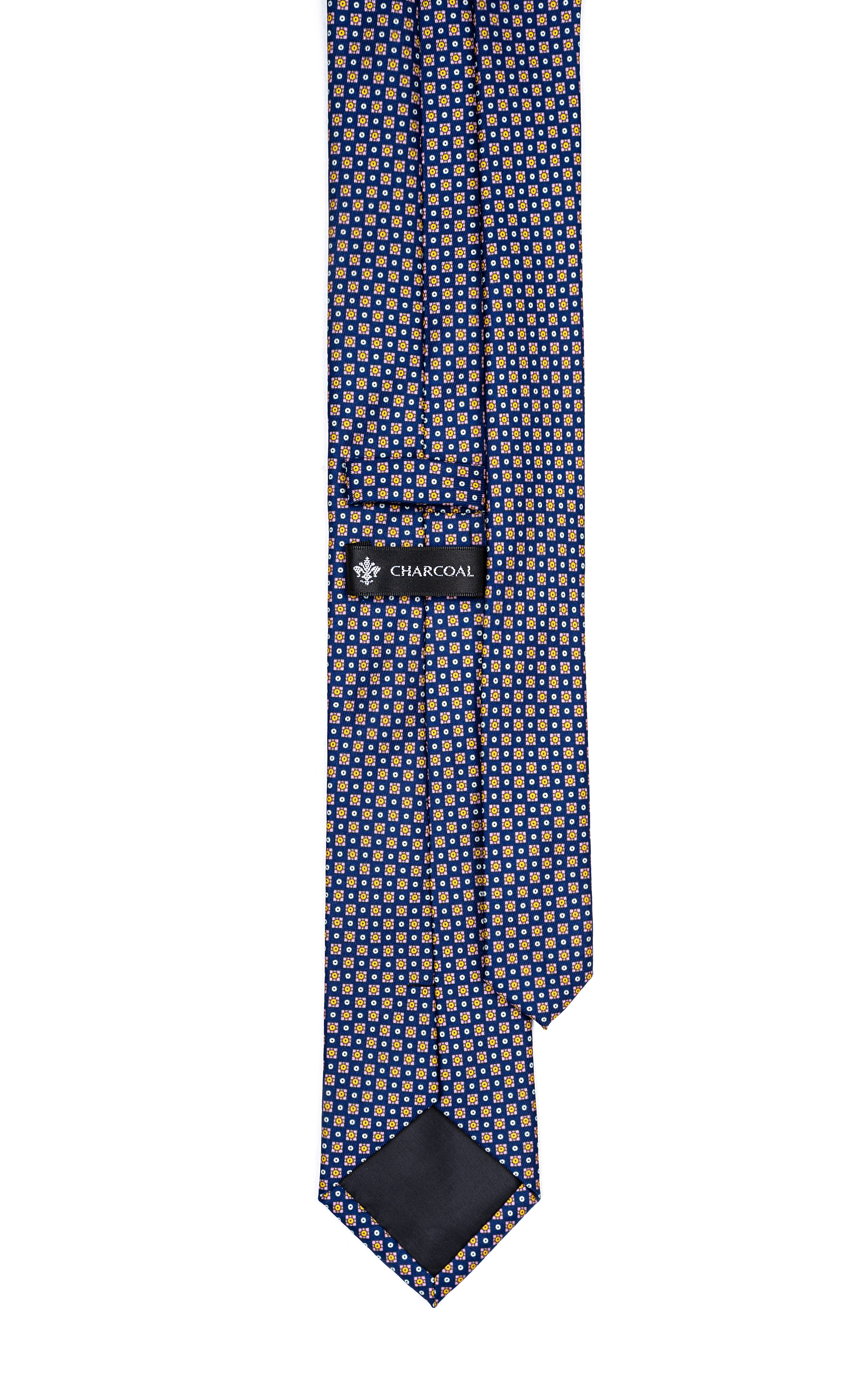 Necktie in navy with micro-pattern and CHARCOAL label at center, pointed ends