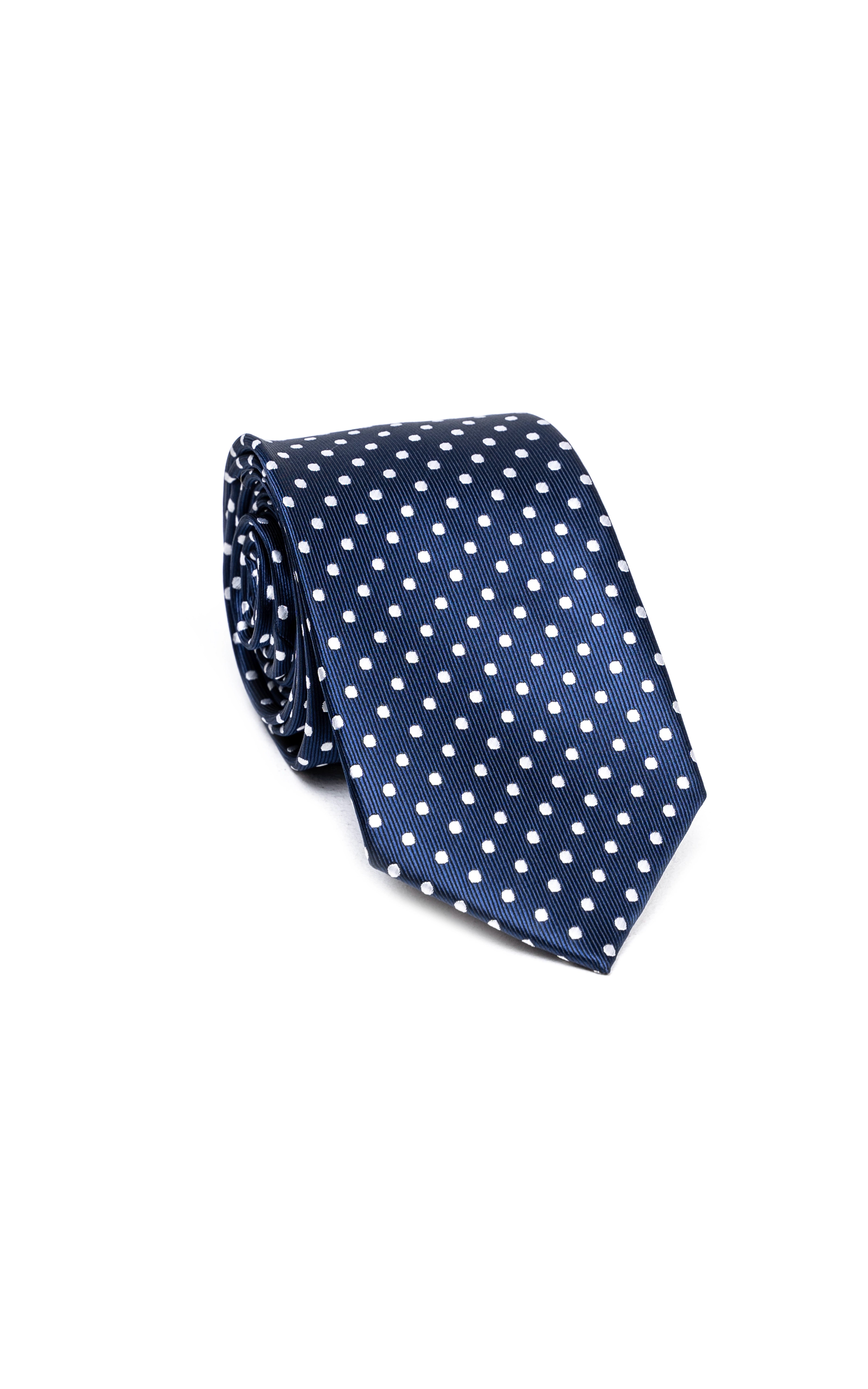 Navy polka-dot necktie with white dots, classic fold and narrow end.