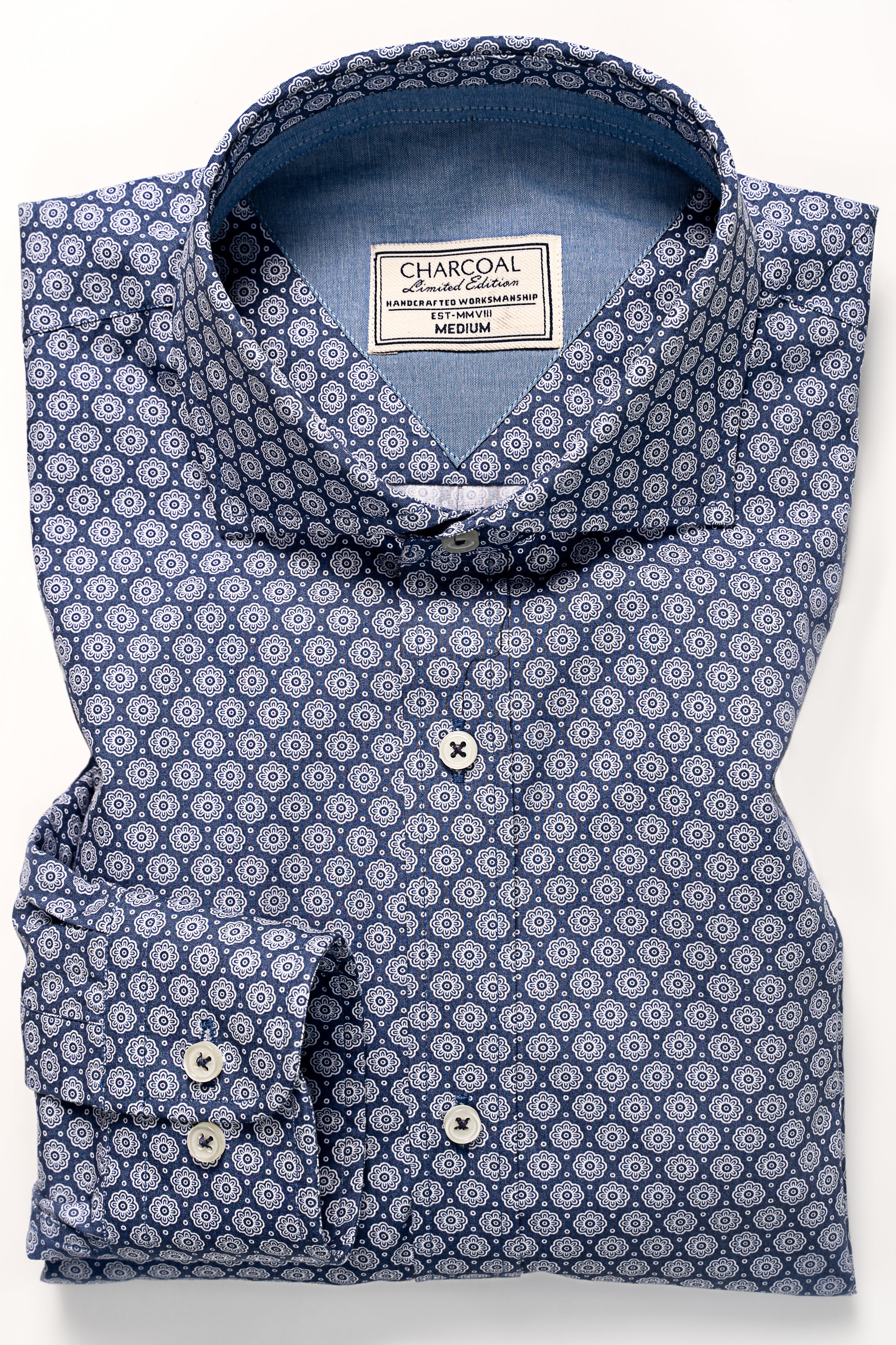 Navy printed dress shirt with button-down collar, short sleeves, and chest label