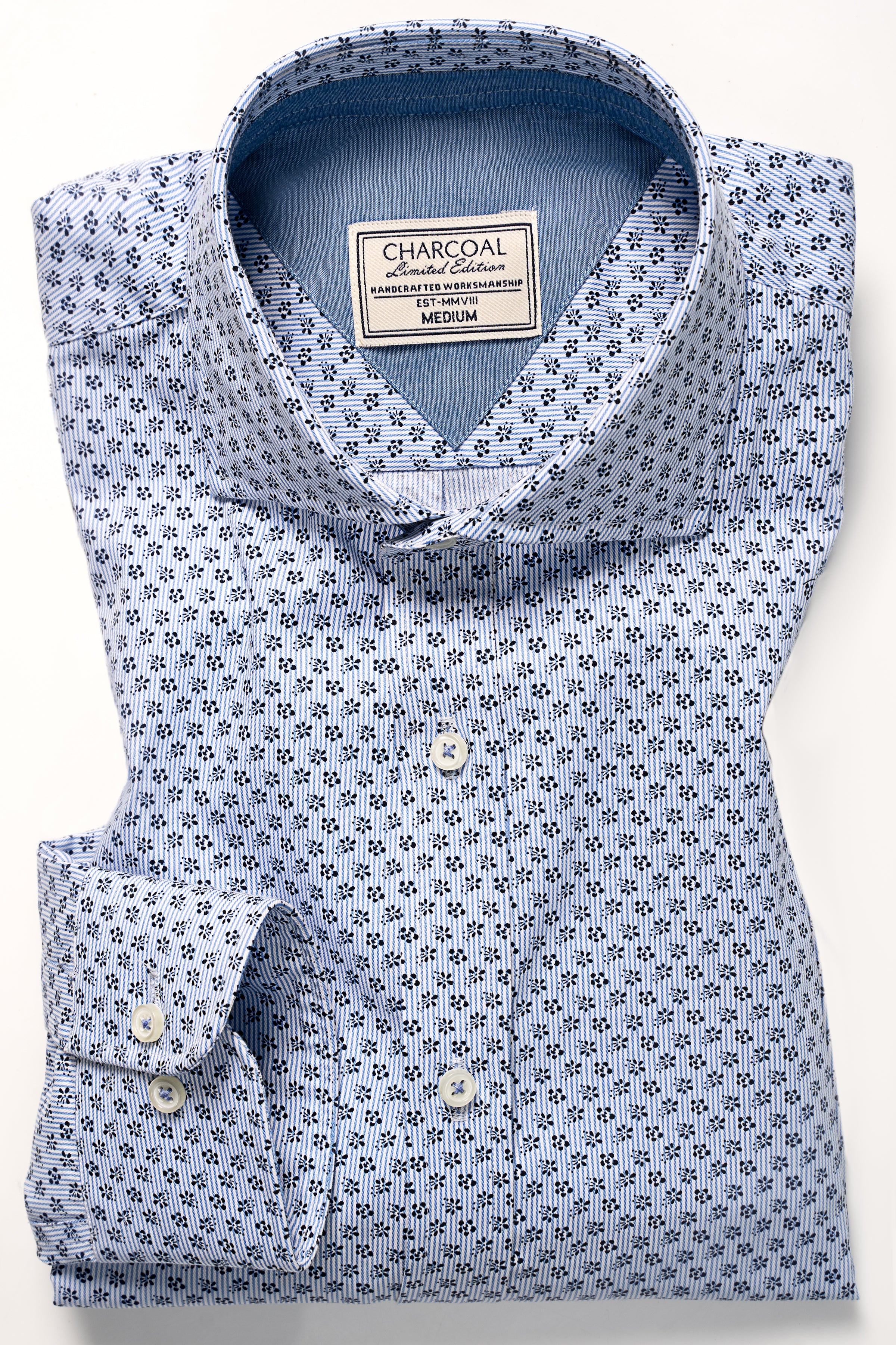 Sky blue button-up shirt with pointed collar and inner label