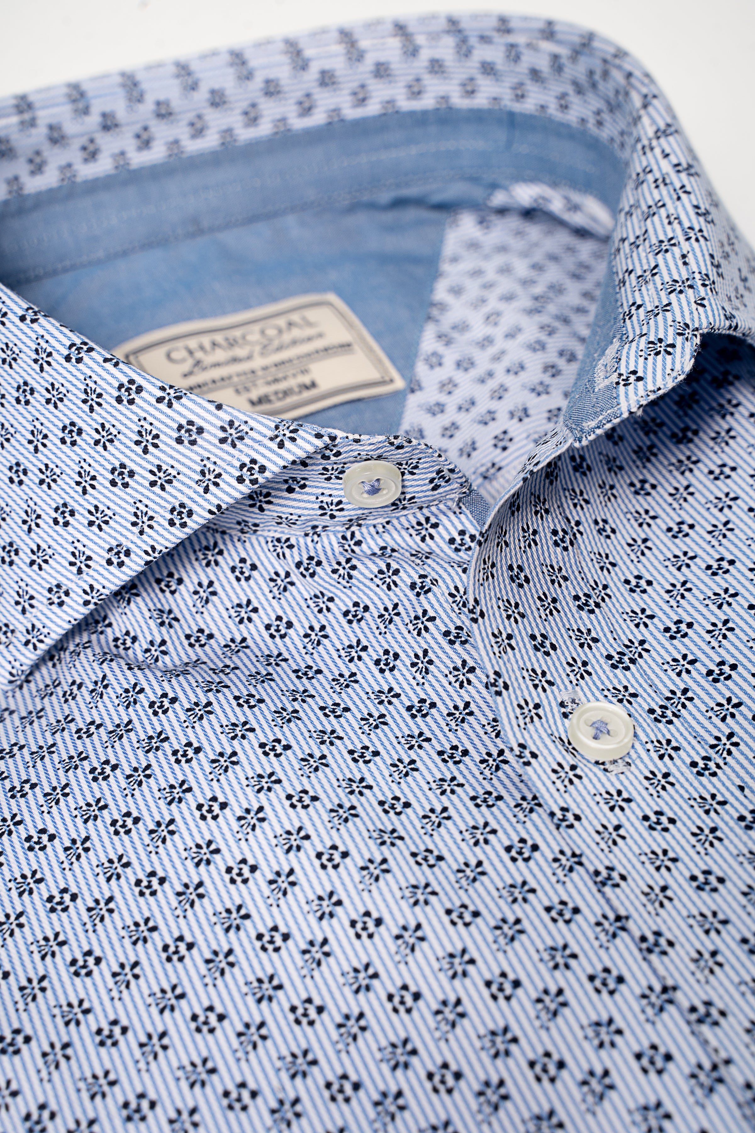 Sky blue shirt collar with buttoned placket and geometric pattern