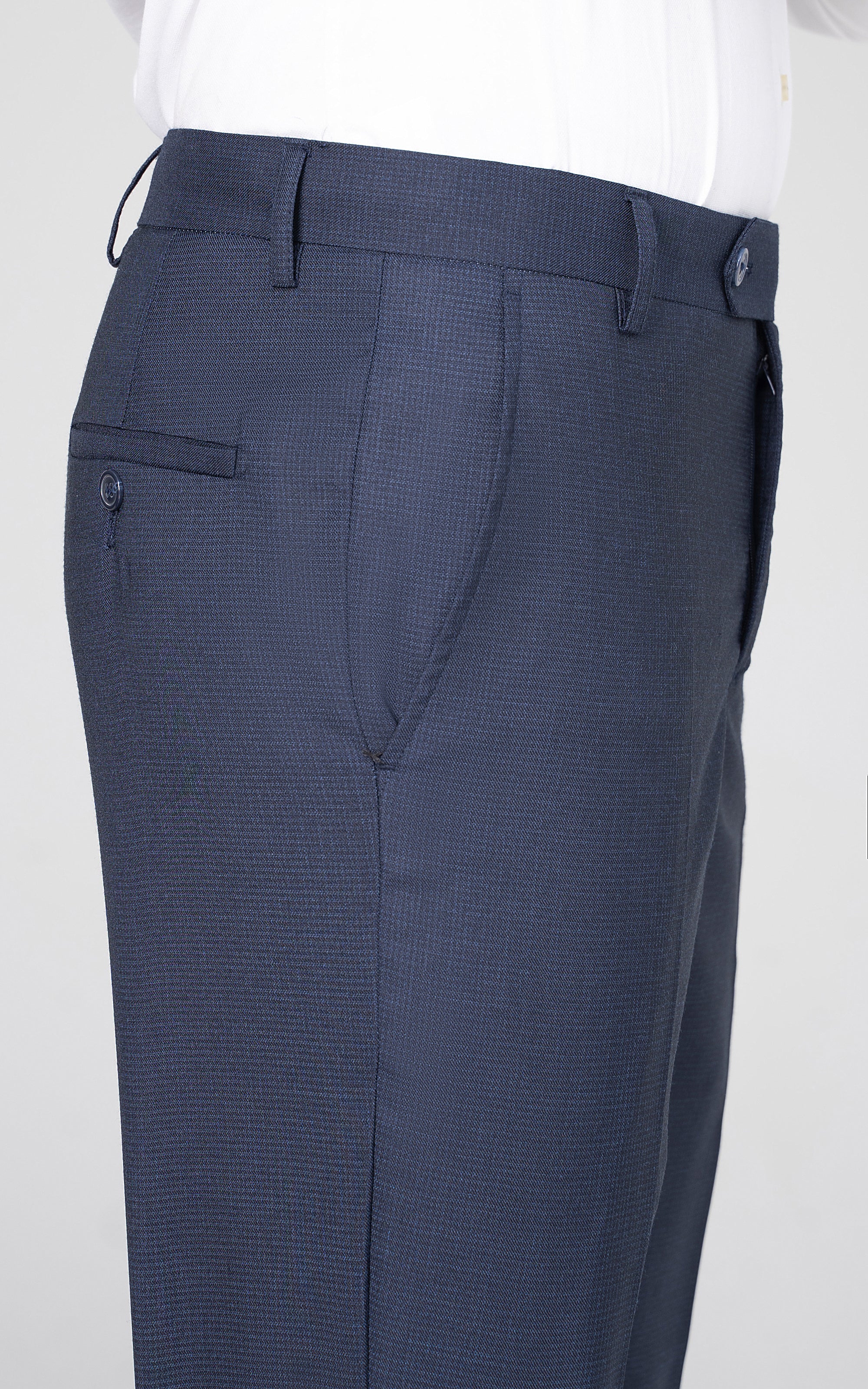 Navy dress pants waistband with belt loops and tailored pockets
