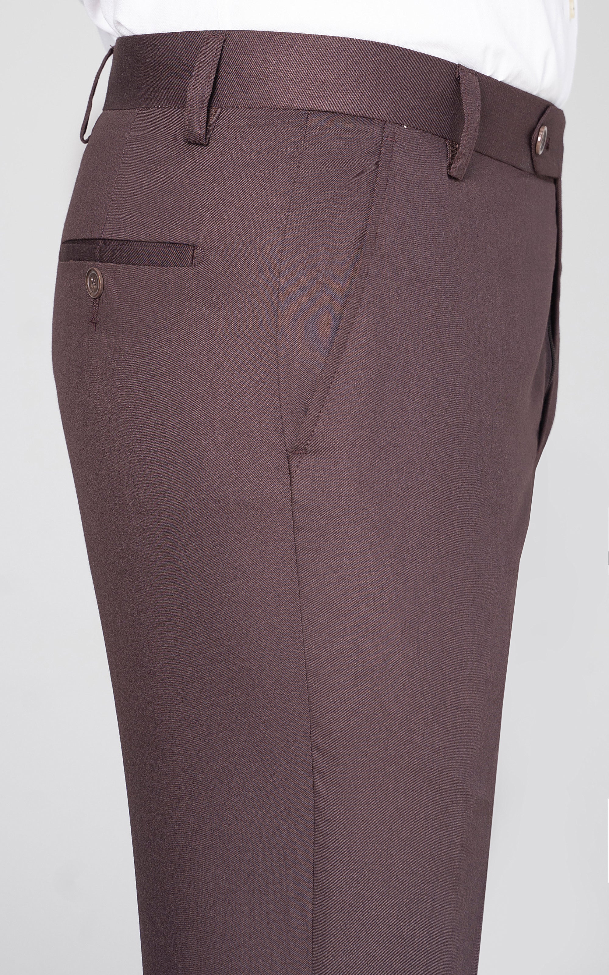 Burgundy dress pants waistband with belt loops, buttoned front pockets, and crease