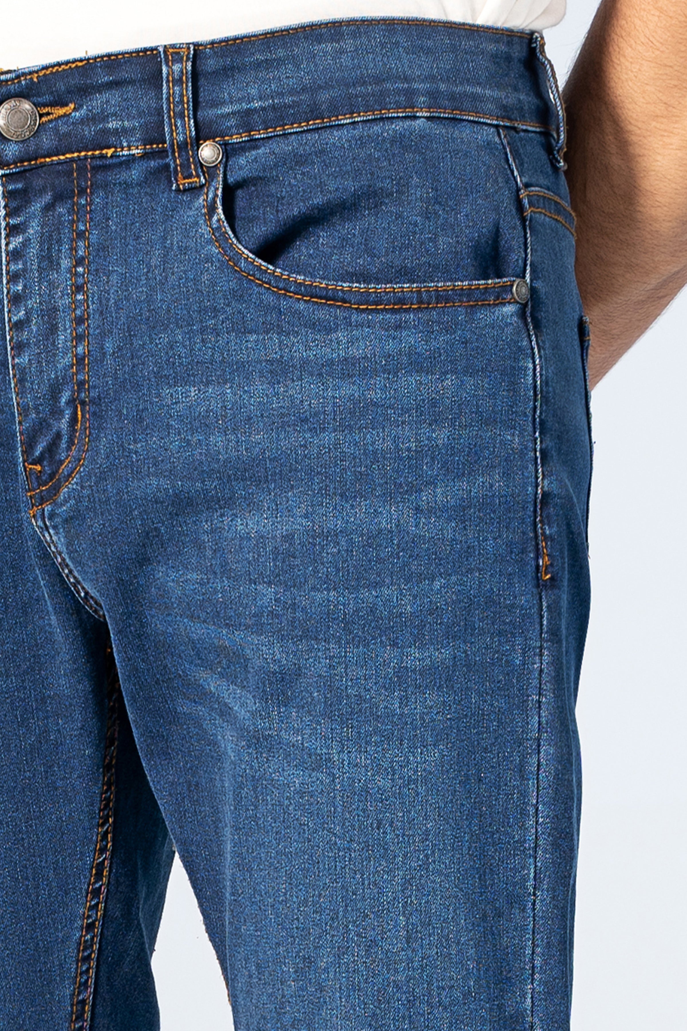 Slim-leg dark blue denim jeans with whiskered front, button fly, front pockets