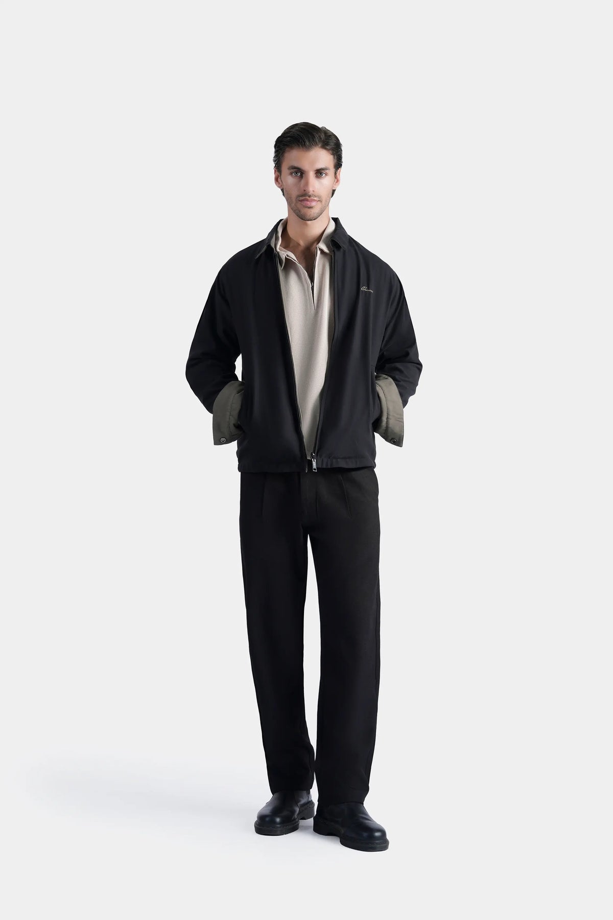 Black reversible collar jacket with zipper front and flap pockets, standing collar