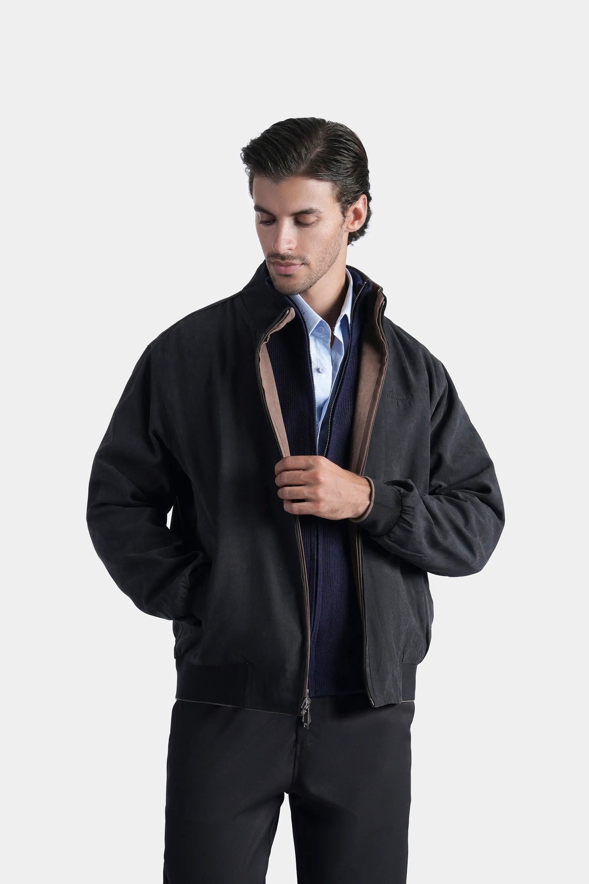 Charcoal reversible jacket with zipper and brown inner lining at opening