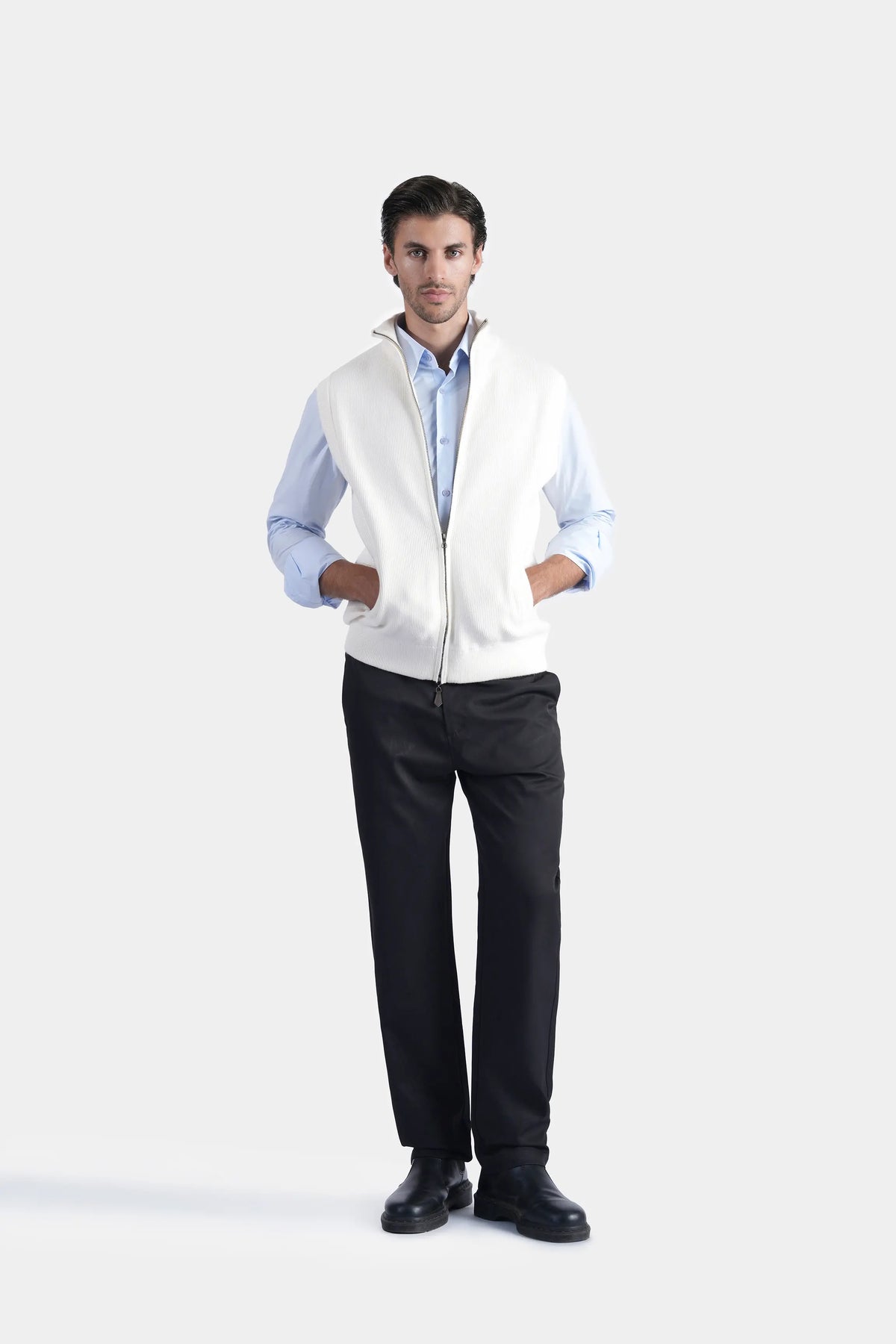 Off-white sleeveless knit sweater vest with high stand collar and zipper front