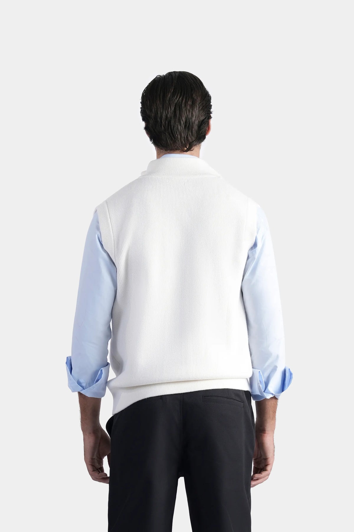 Off-white sleeveless knit sweater vest with high stand collar, back view