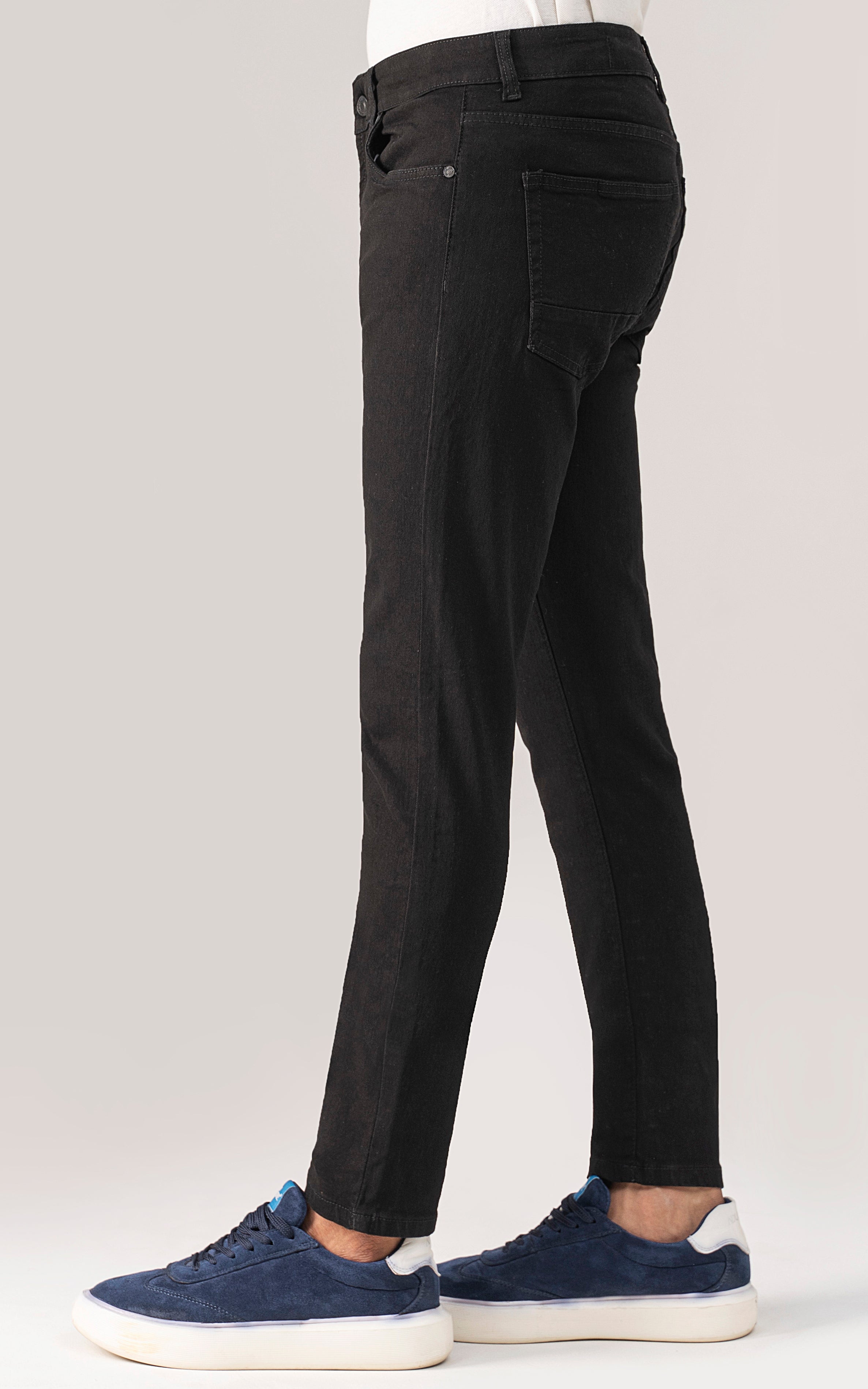 Slim-fit black jeans, five-pocket style with belt loops and zip fly