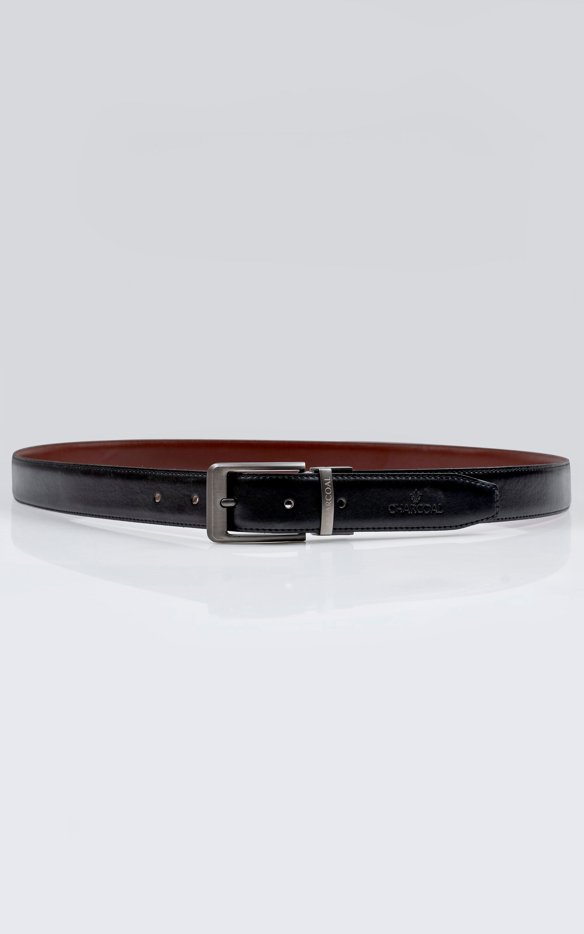 Black leather reversible belt with silver-tone rectangular buckle and keeper