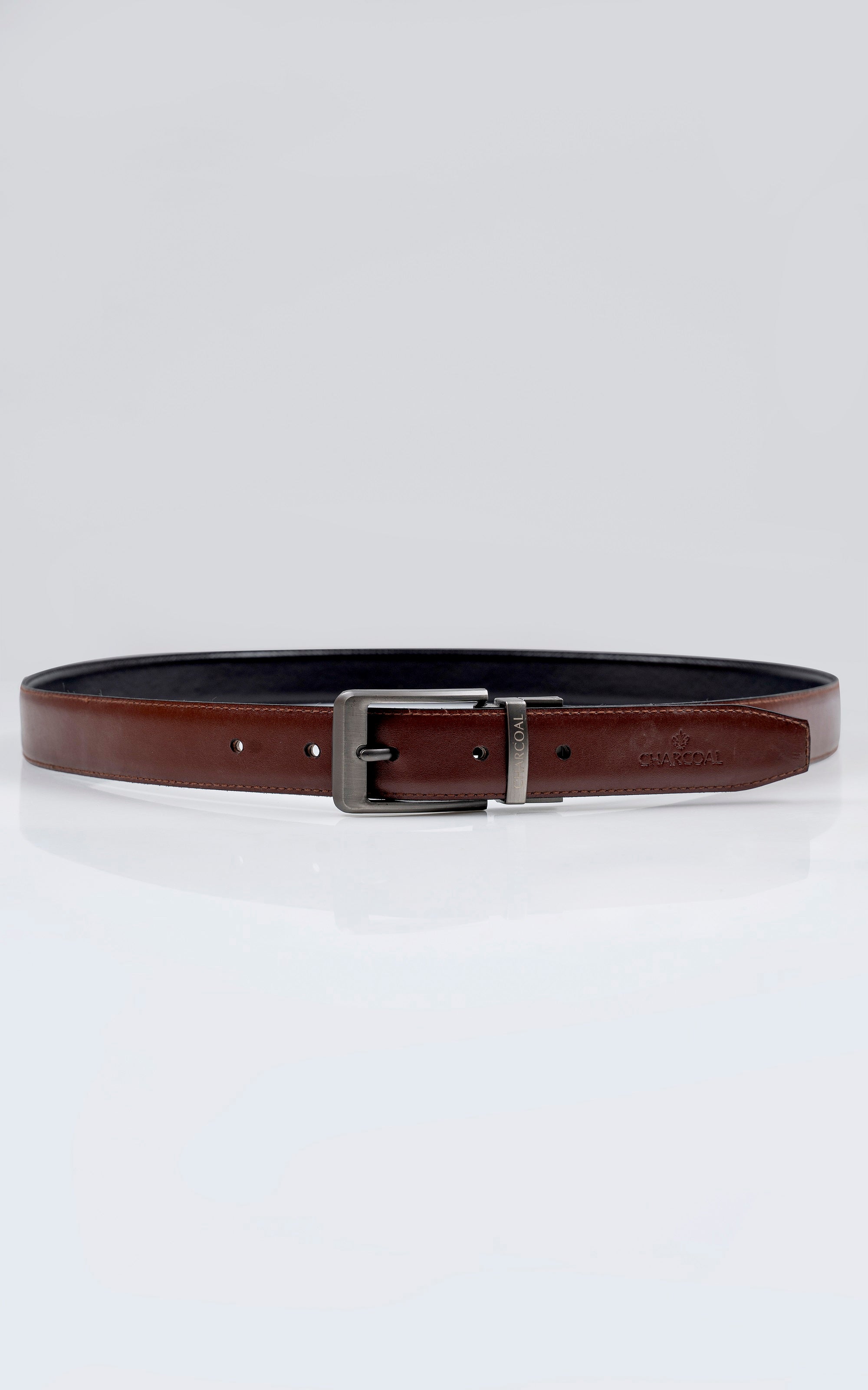 Brown leather belt with black edge trim and silver-tone buckle