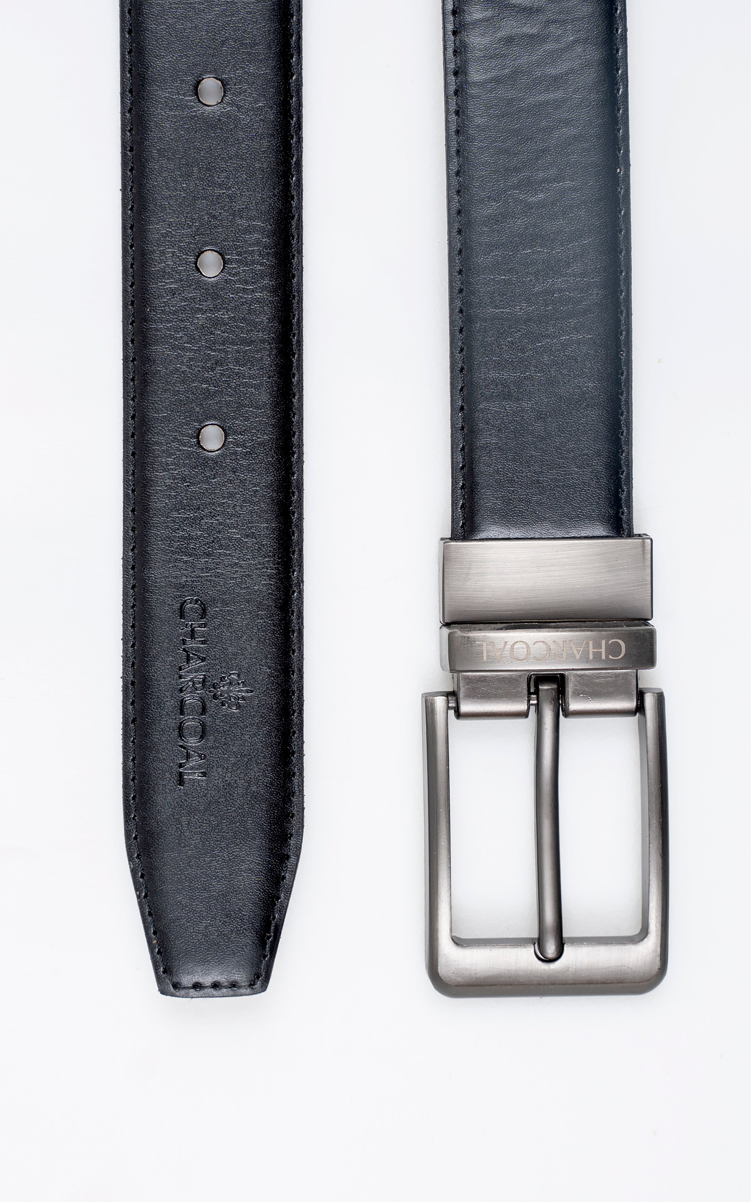 Black leather belt strap detail with punched holes and silver-tone buckle