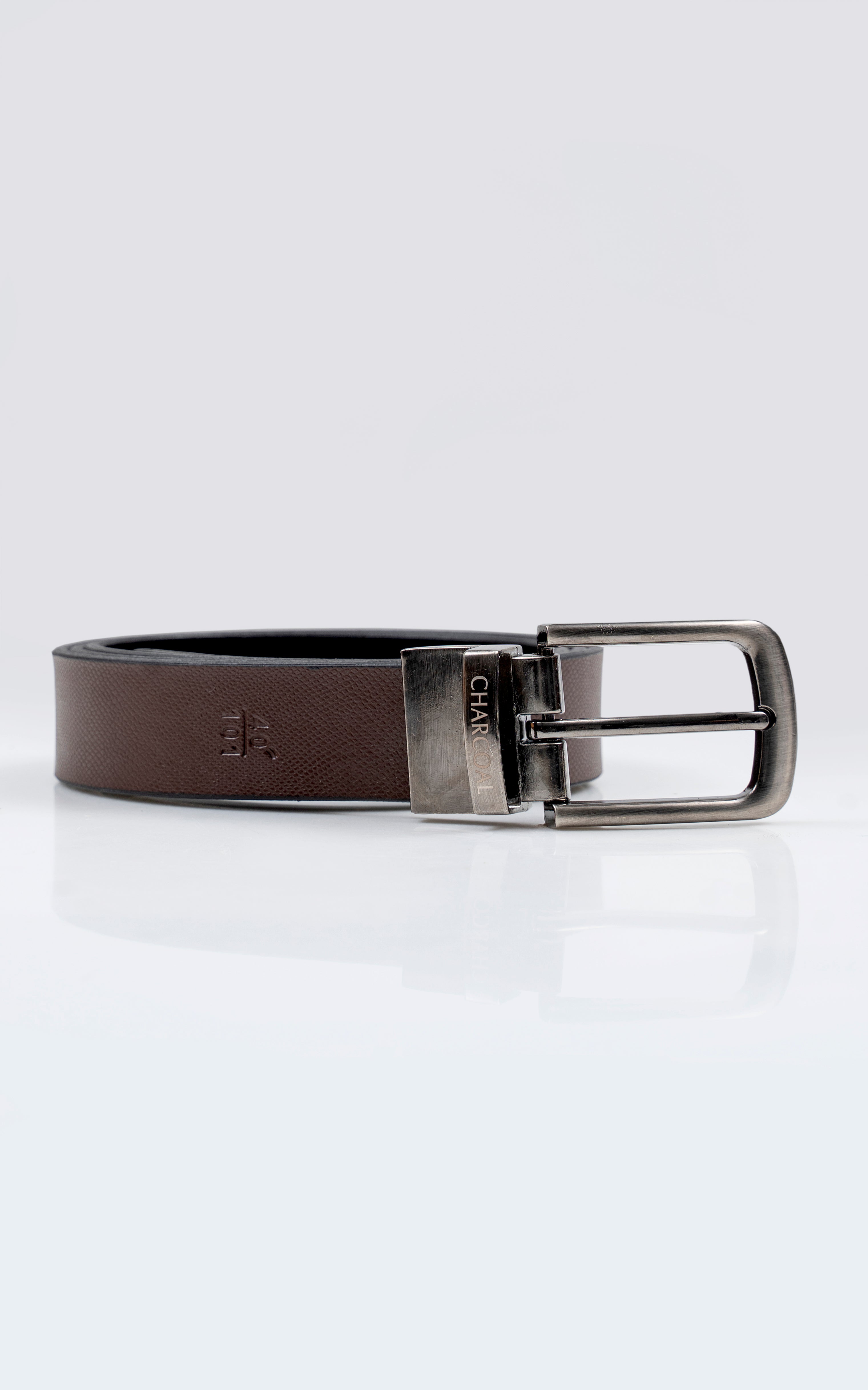 Reversible leather belt with silver buckle, brown strap with stitched texture and dark lining.