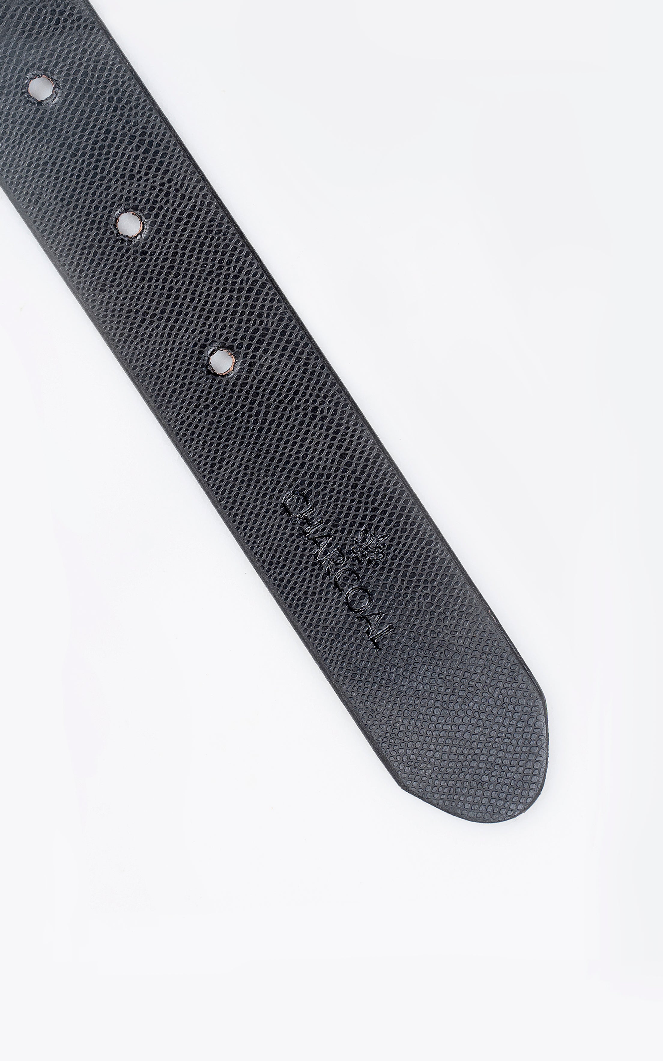 Dark textured leather belt end with three button holes and embossed logo near edge.