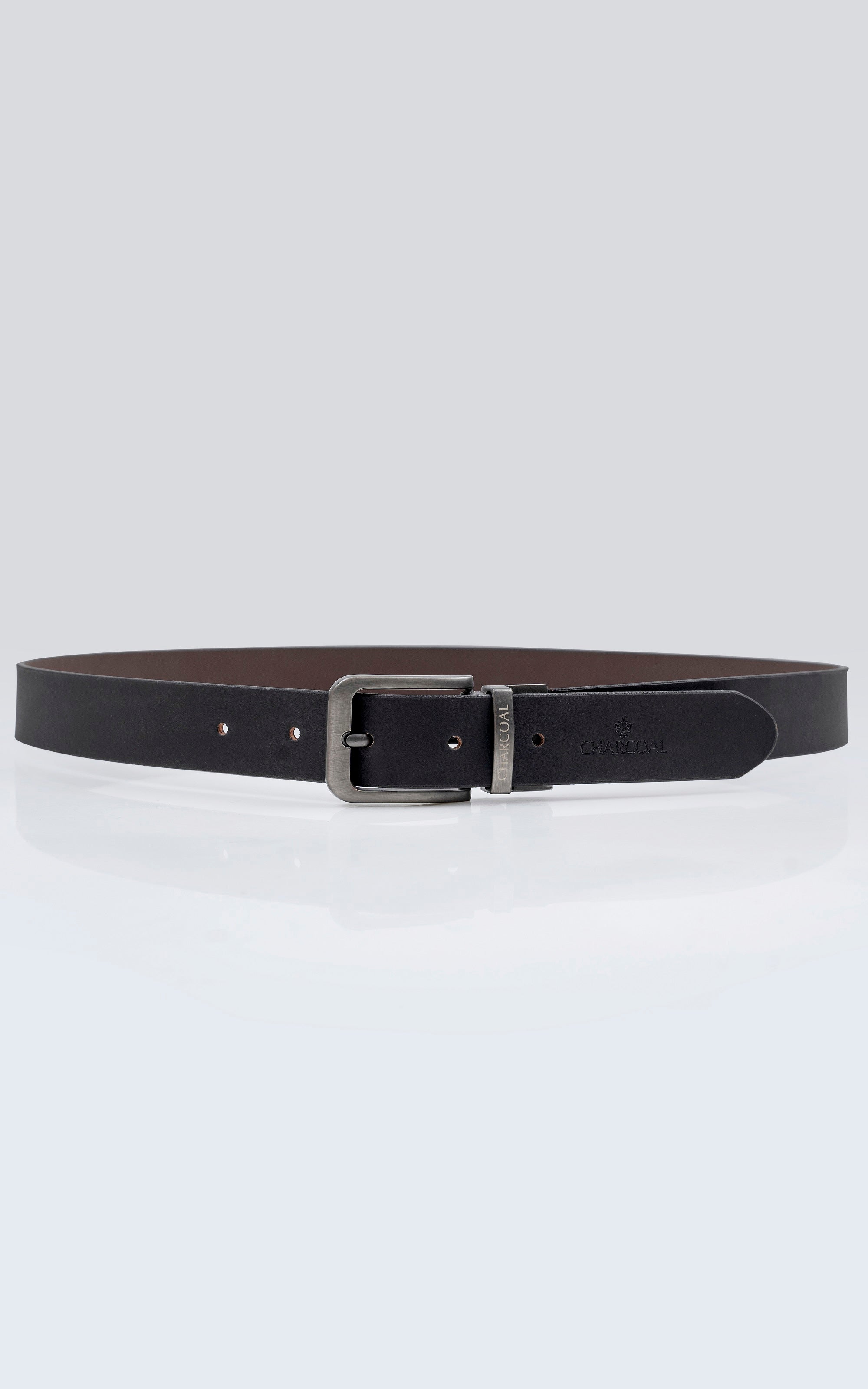 Reversible leather belt with silver buckle and dark strap with punched holes