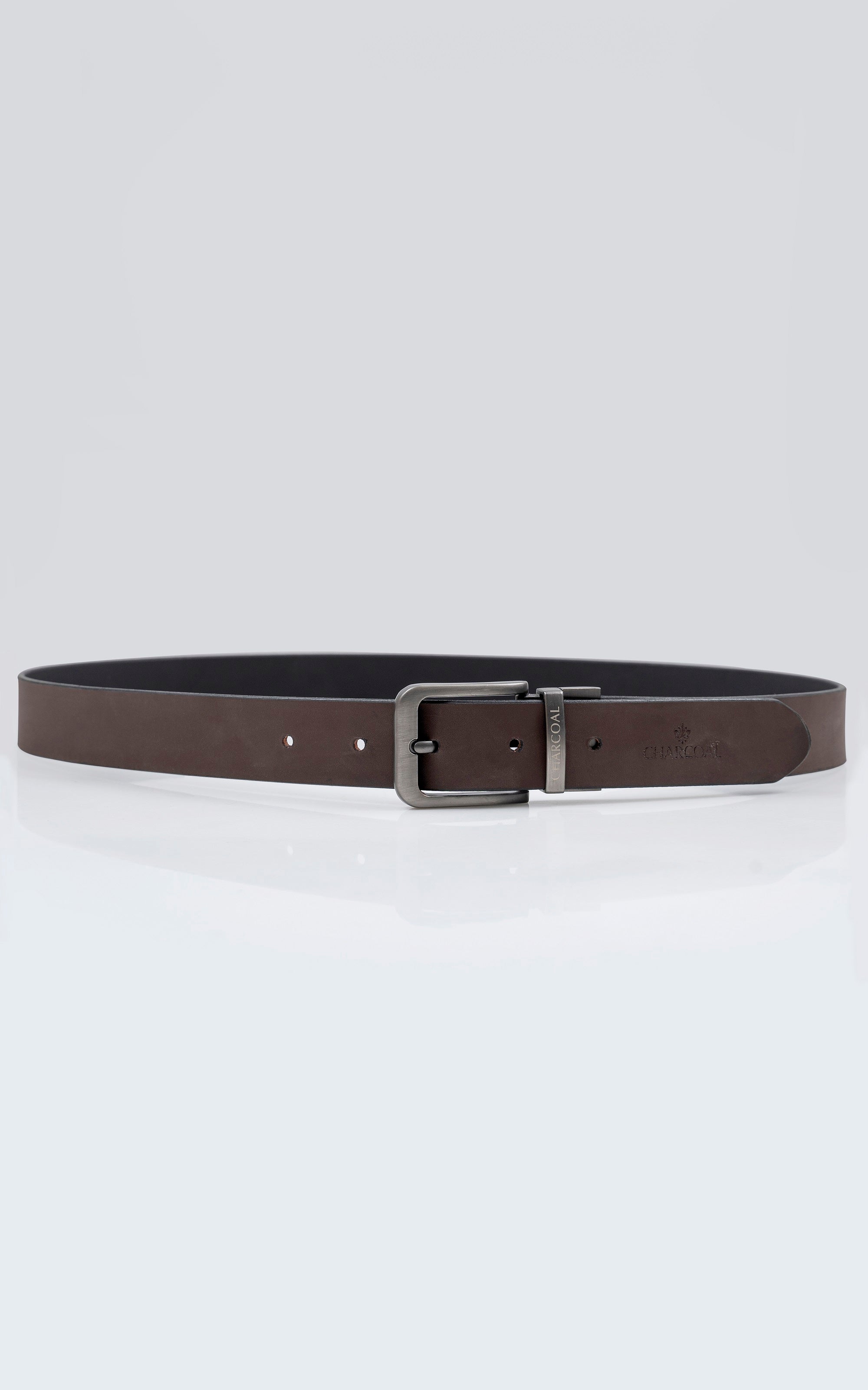 Reversible leather belt with silver buckle and dark strap with embossed text