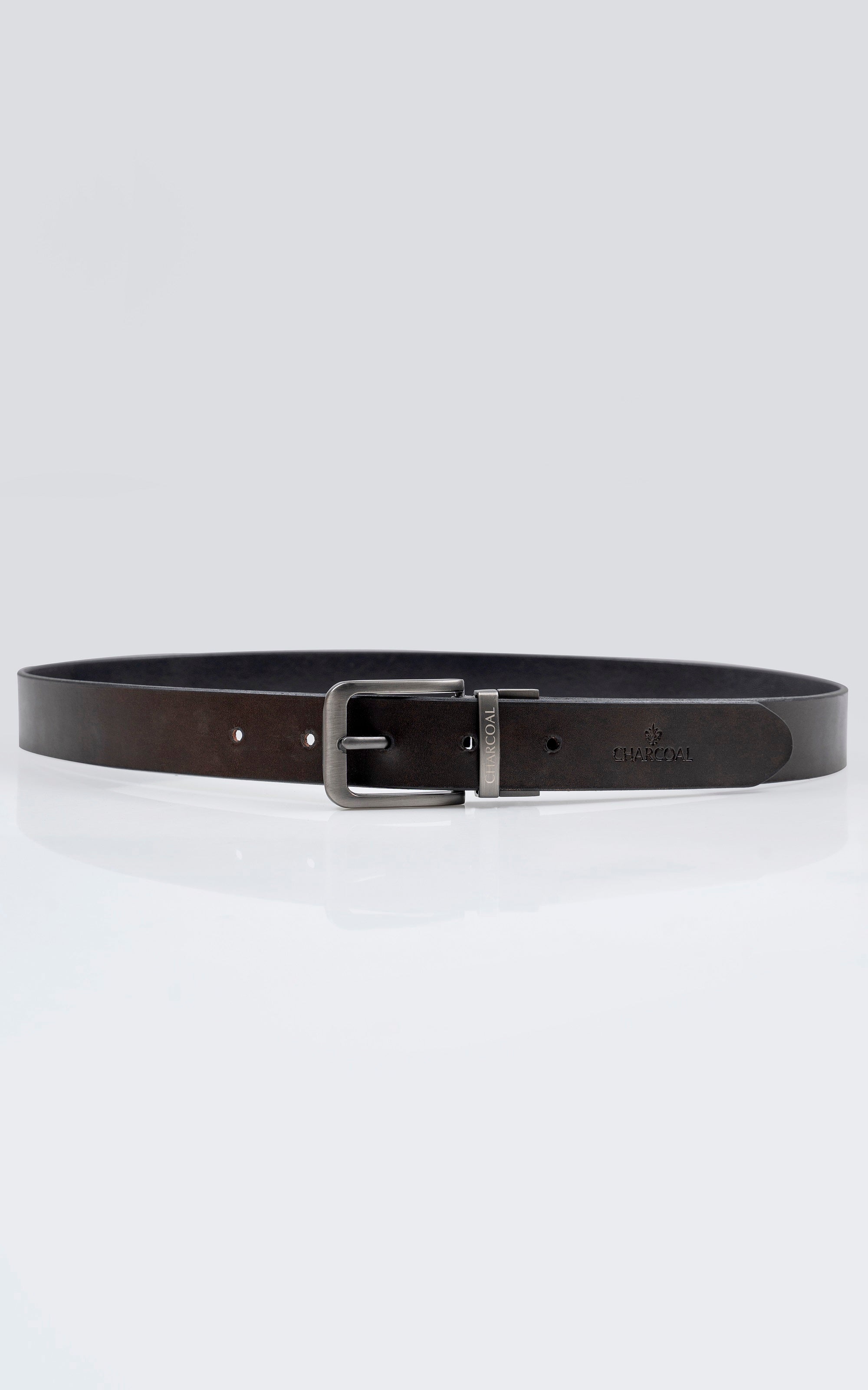 Reversible leather belt side view, dark leather strap with silver buckle and holes