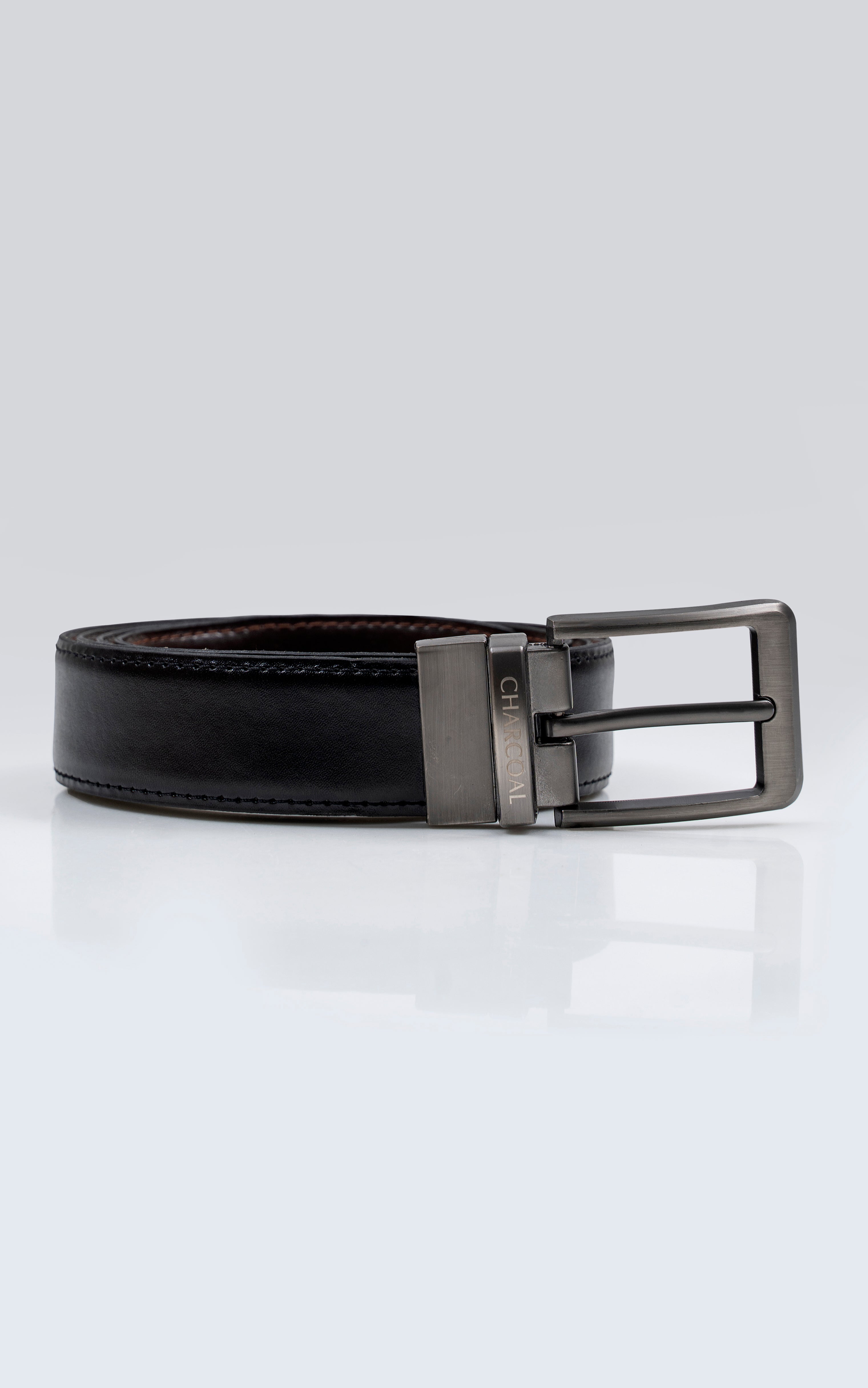 Reversible leather belt with silver rectangular buckle, dark exterior with stitching