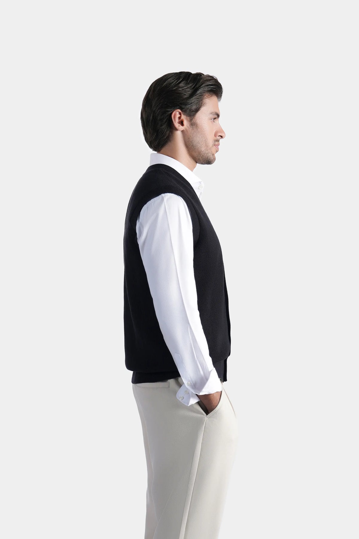 Black V-neck sleeveless knit sweater vest with button front, side view