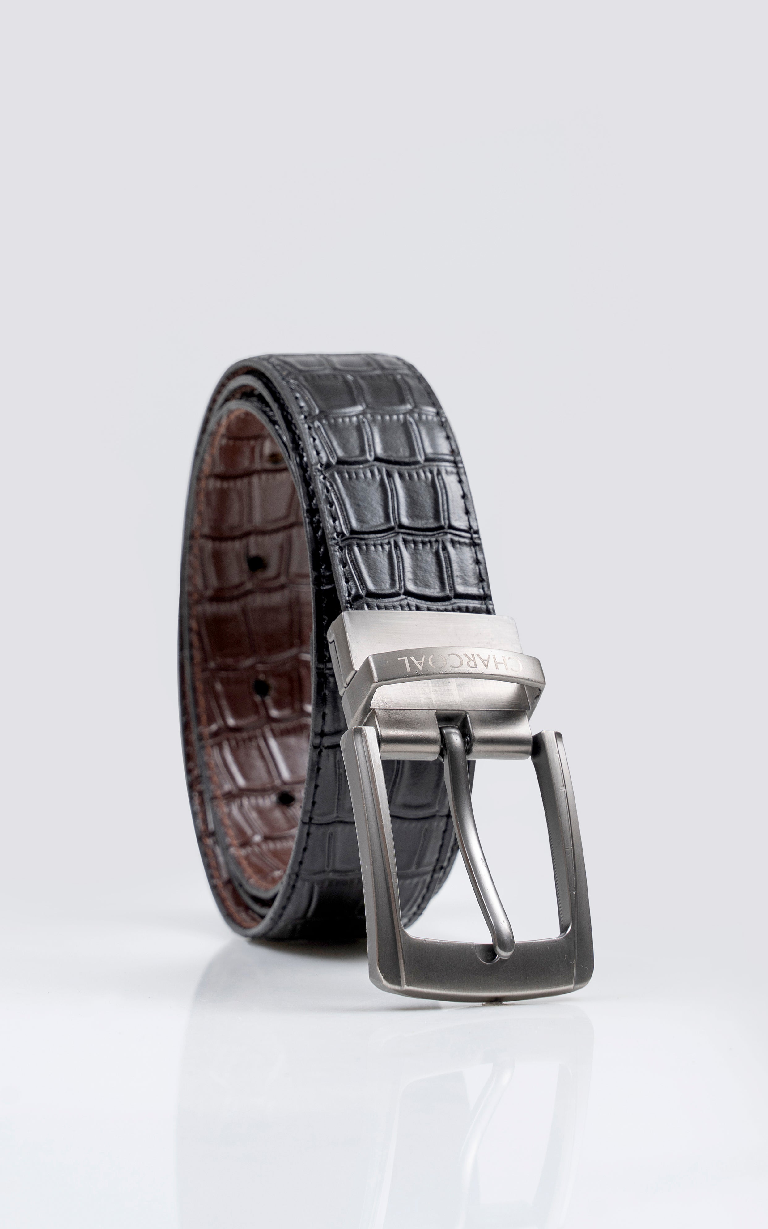 Crocodile-embossed leather belt with dark strap and chrome square buckle.