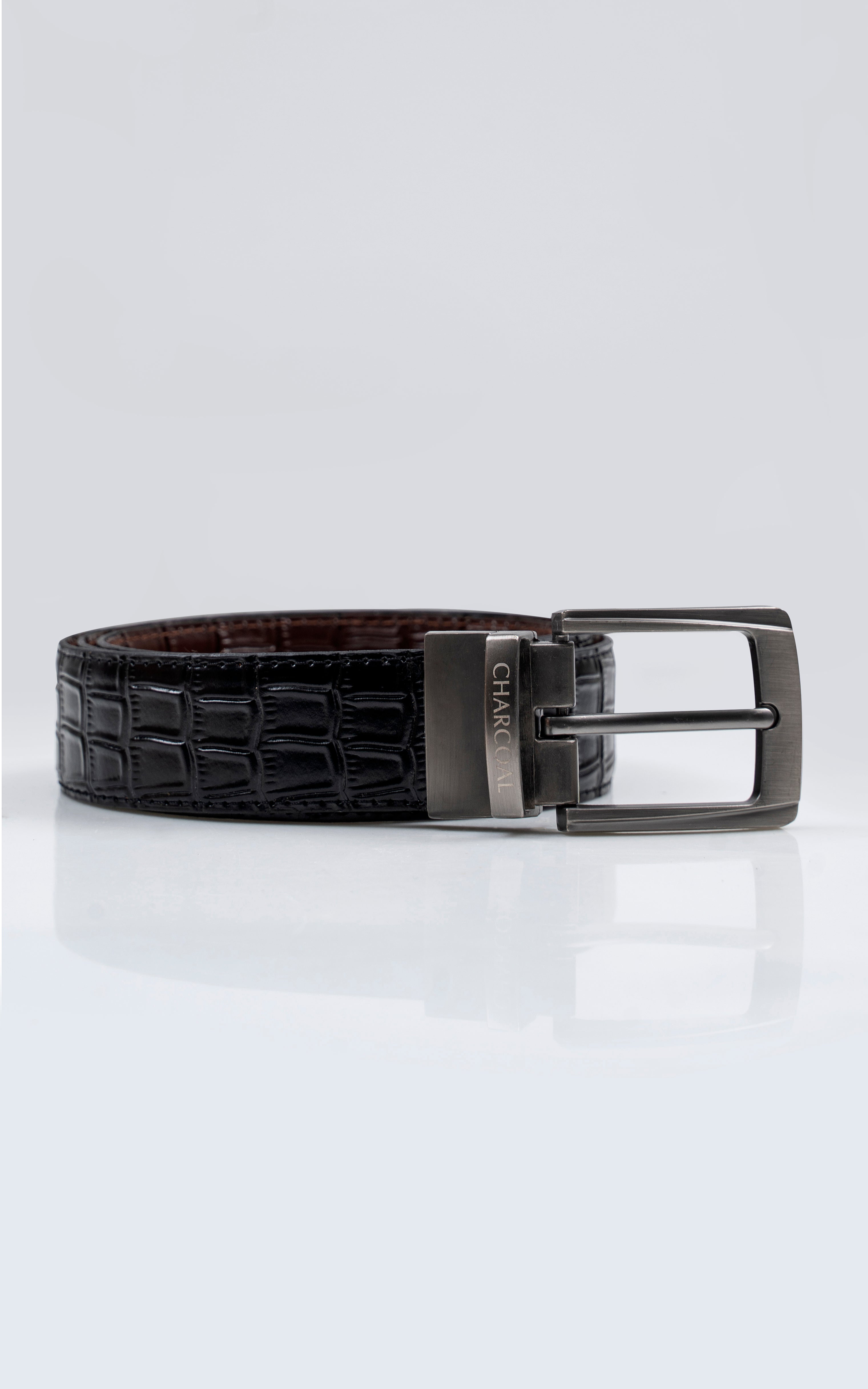 Crocodile-embossed leather belt in dark and brown with rectangular metal buckle.