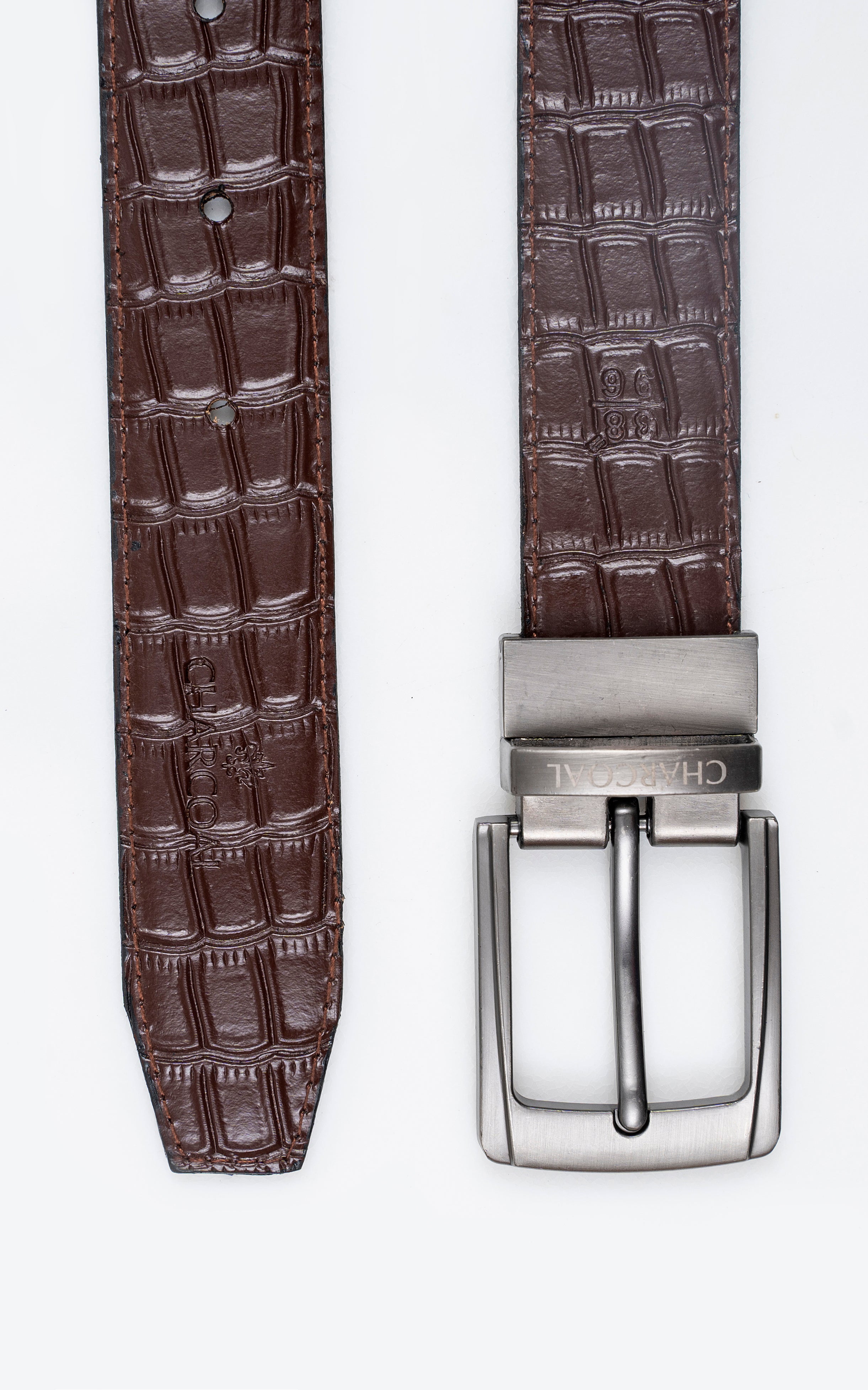 Two-sided leather belt display: brown crocodile strap with metal square buckle.