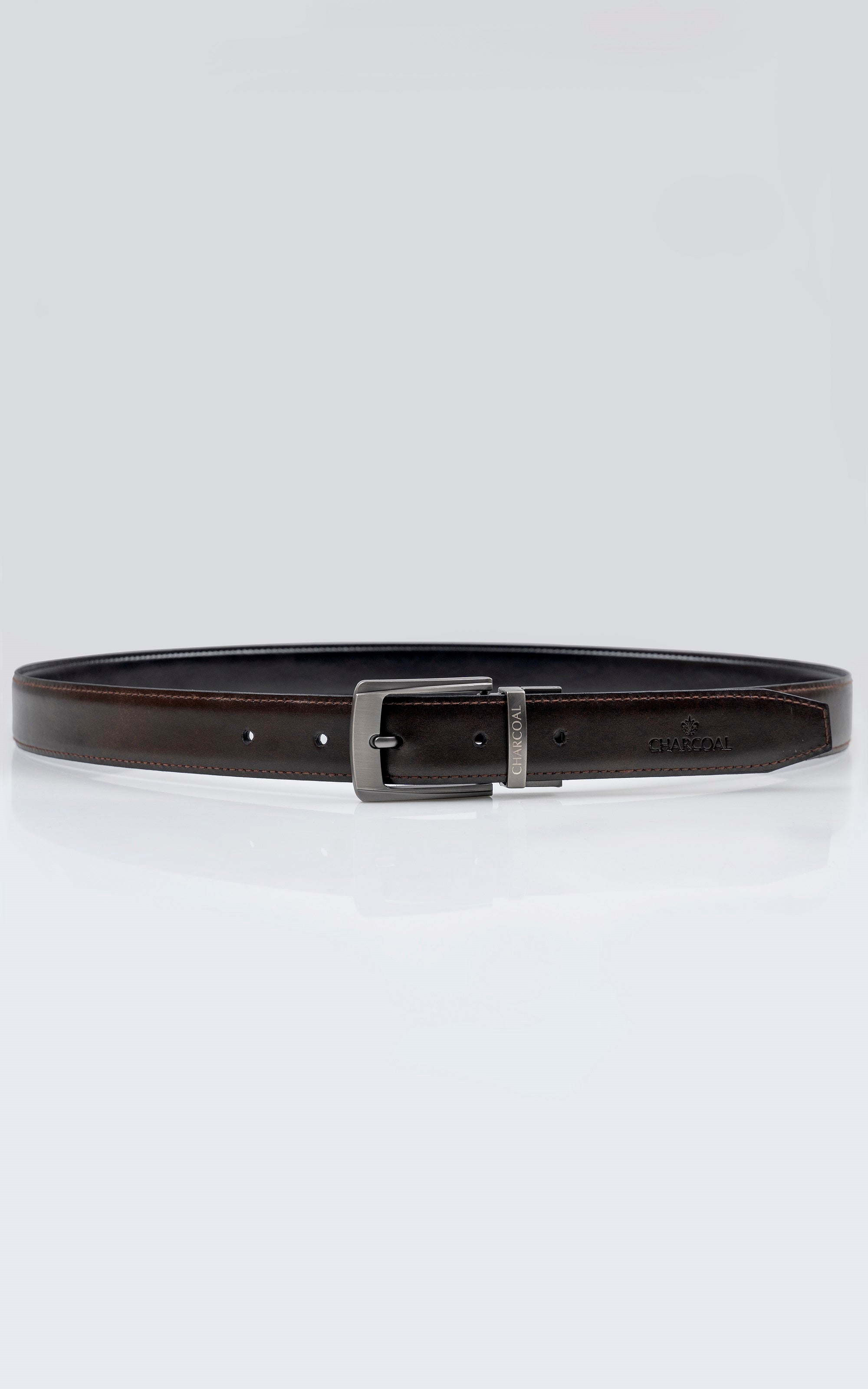 Brown leather belt with rectangular metal buckle and belt keeper holes