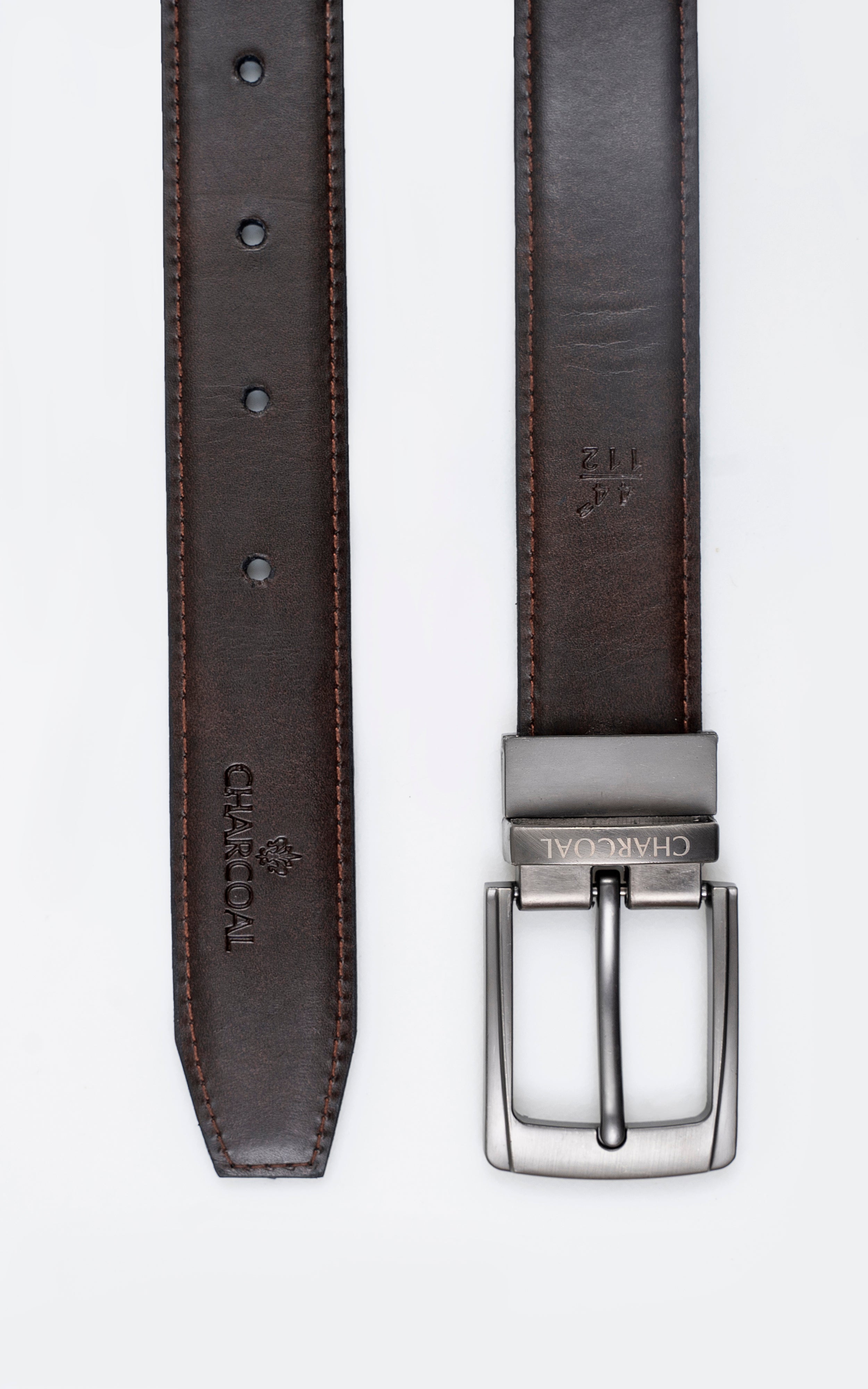 Brown leather belt strap with keeper holes and silver rectangular buckle