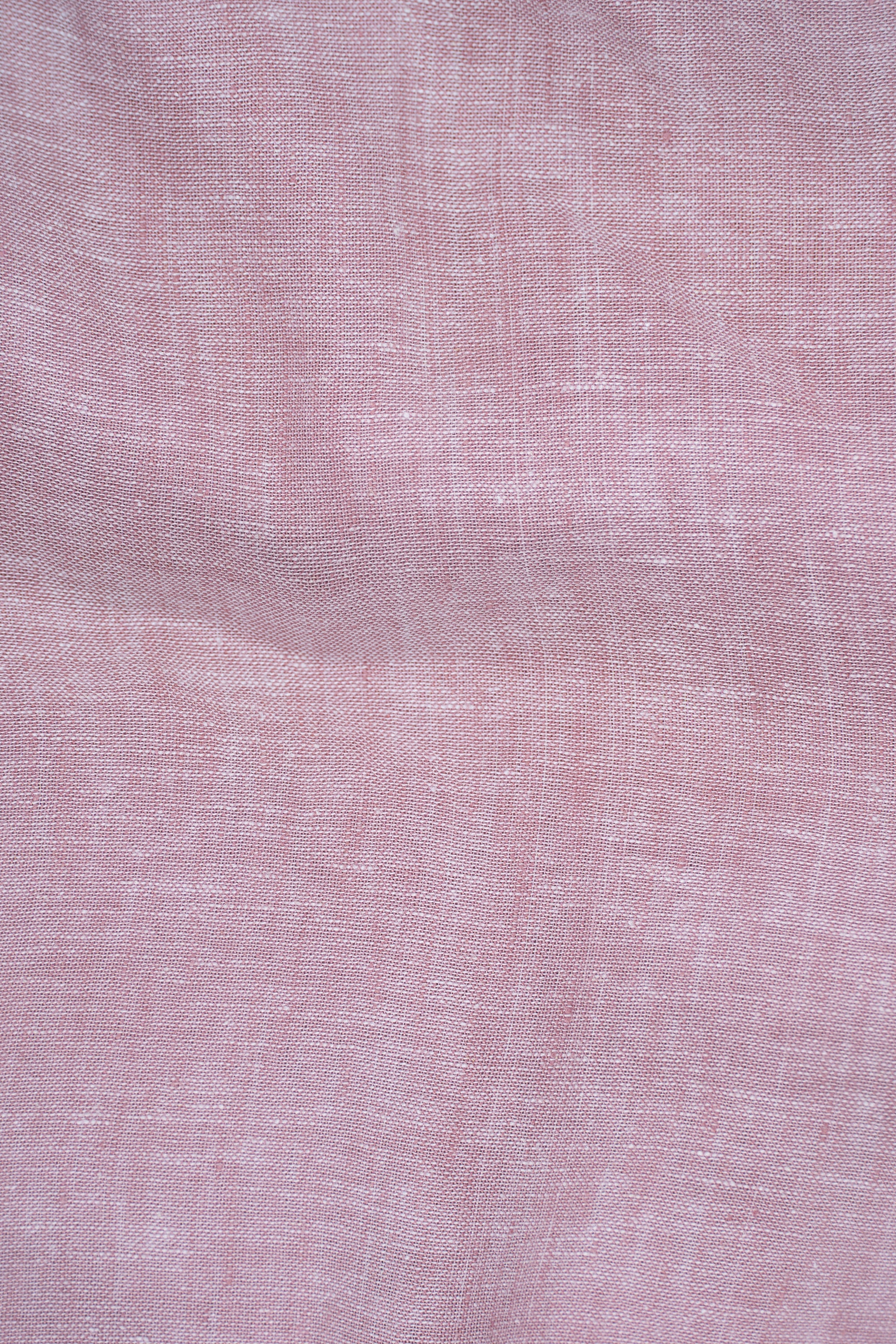 Coral pink linen fabric with subtle textured weave