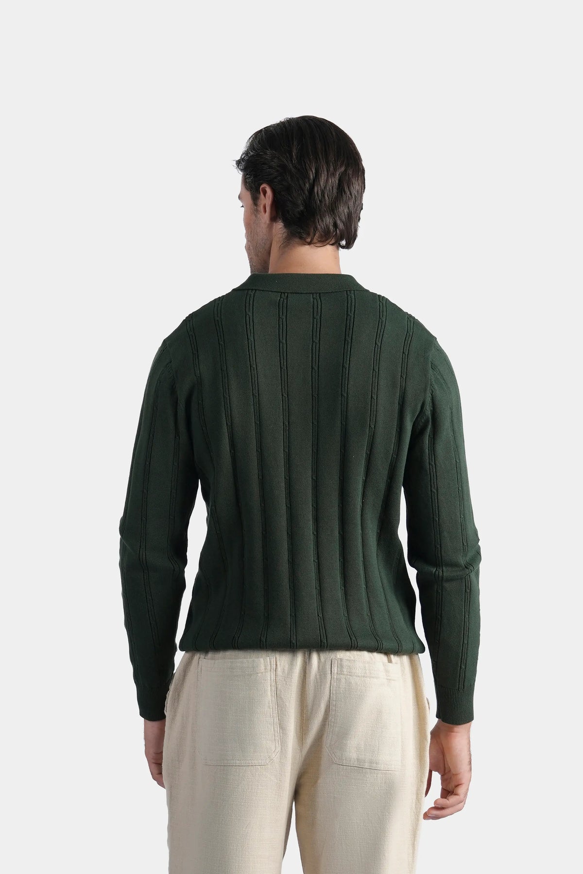 Men's dark green cable knit sweater back view with long sleeves and ribbed cuffs