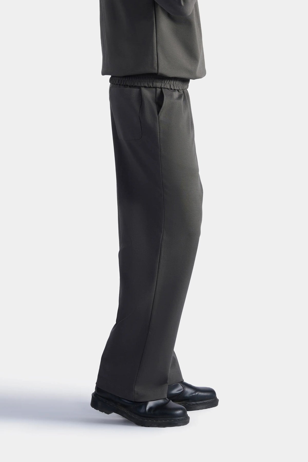 Grey scuba trousers side view with elastic waist and relaxed straight fit