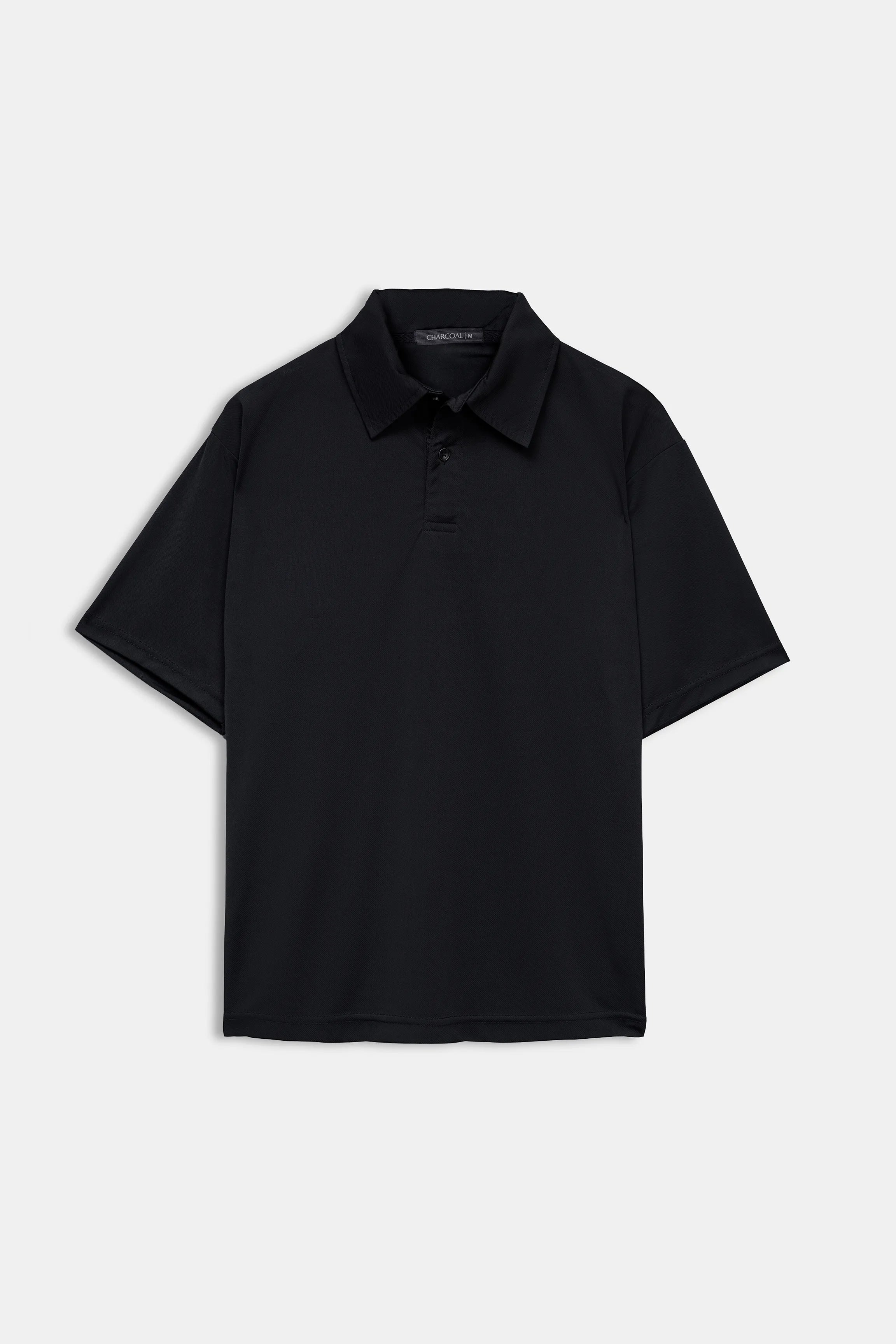 Black loose-fit polo shirt, short sleeves and button placket on white background