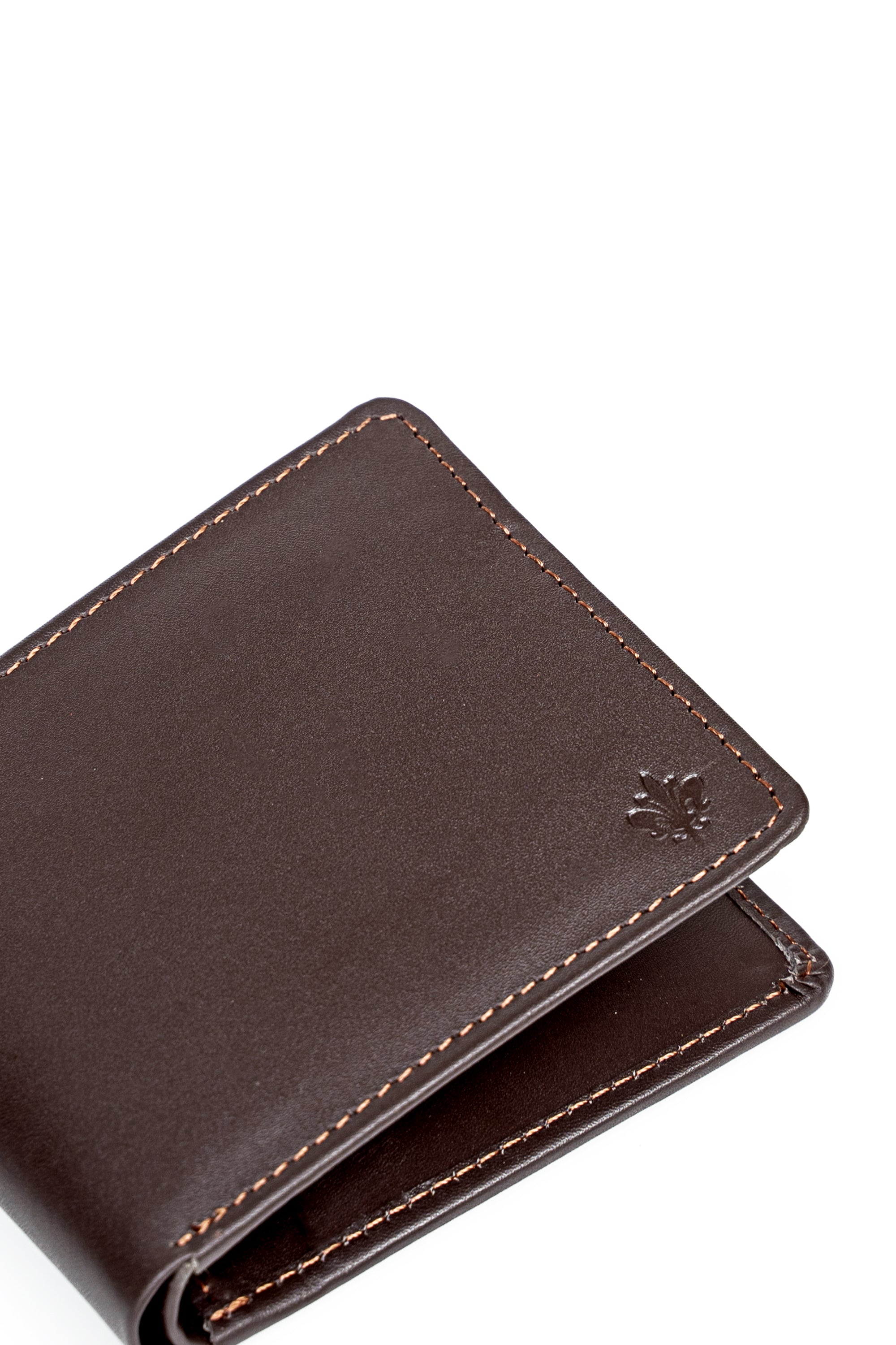 Brown leather wallet close-up with embossed emblem and contrast stitching