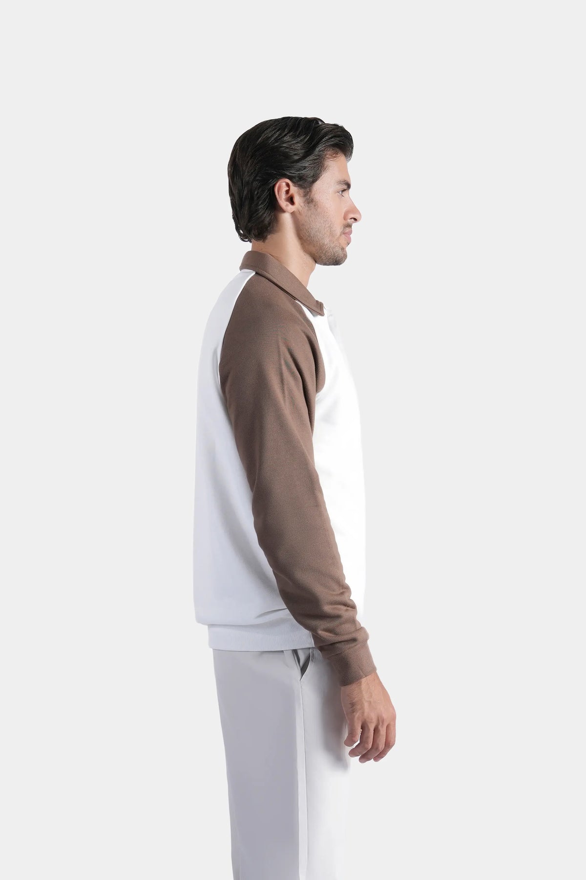 Men's raglan polo sweatshirt, side view: brown sleeves over white body