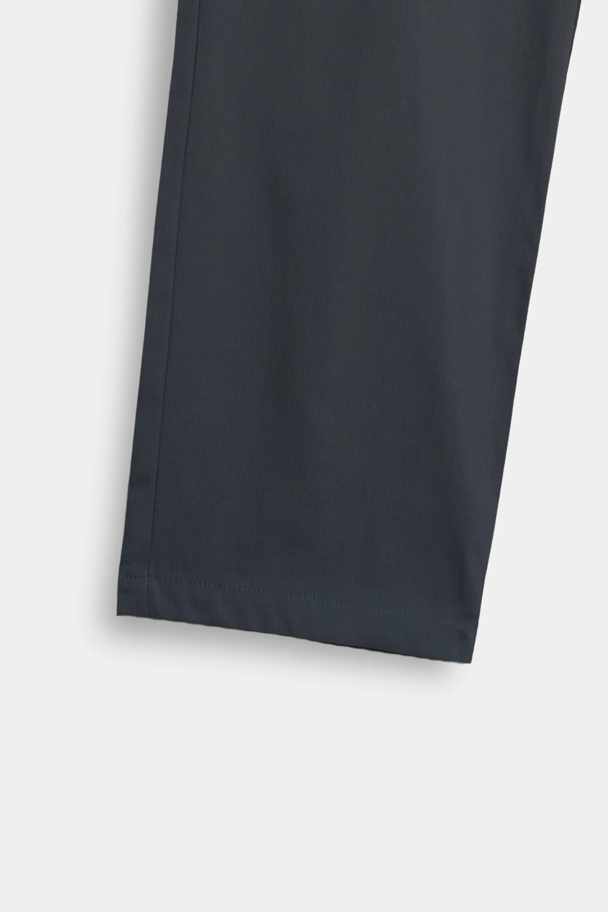 Dark grey straight-leg trousers with clean hem and minimal seam detail