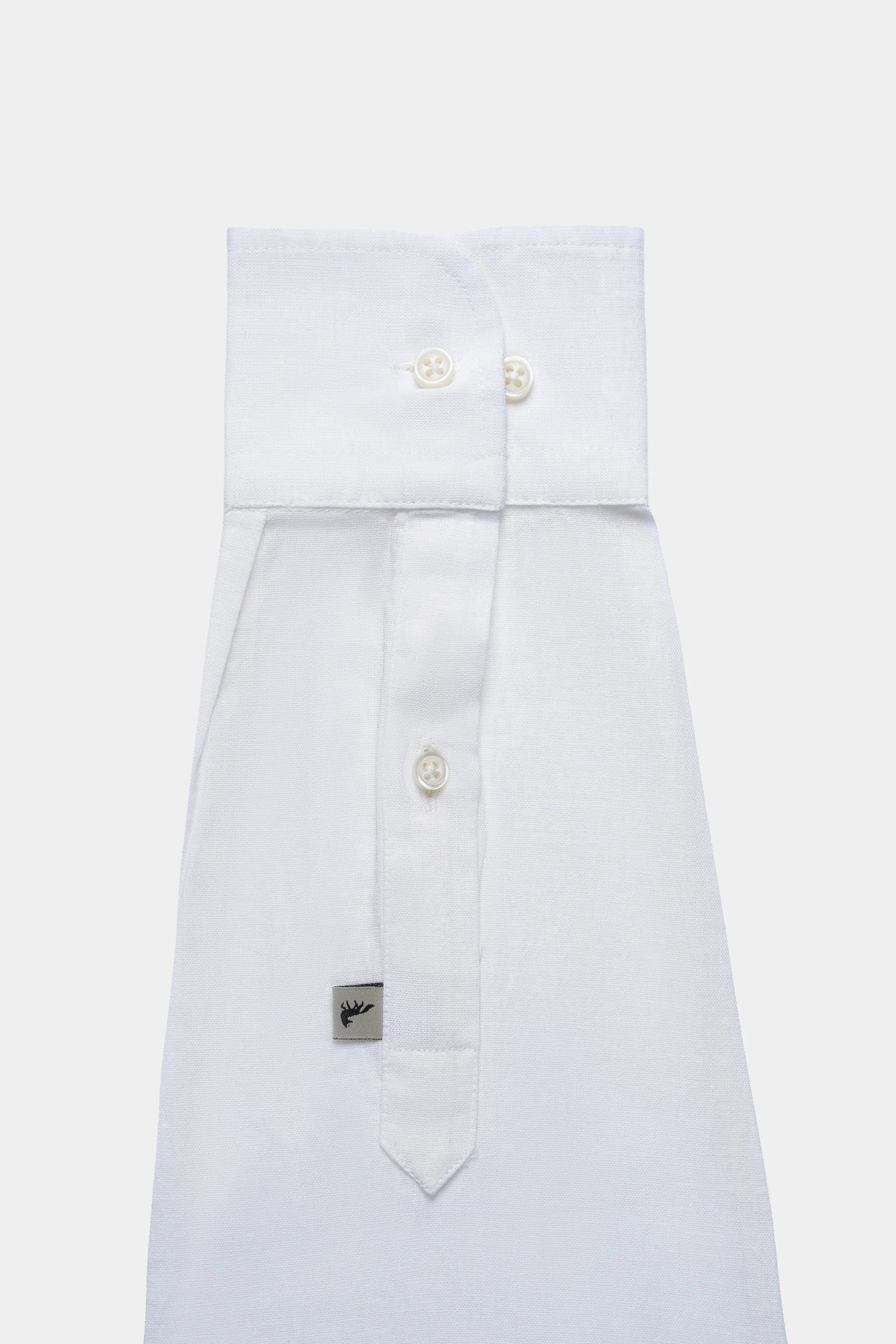 White linen shirt front with classic collar, gold-tone buttons, pocket detail