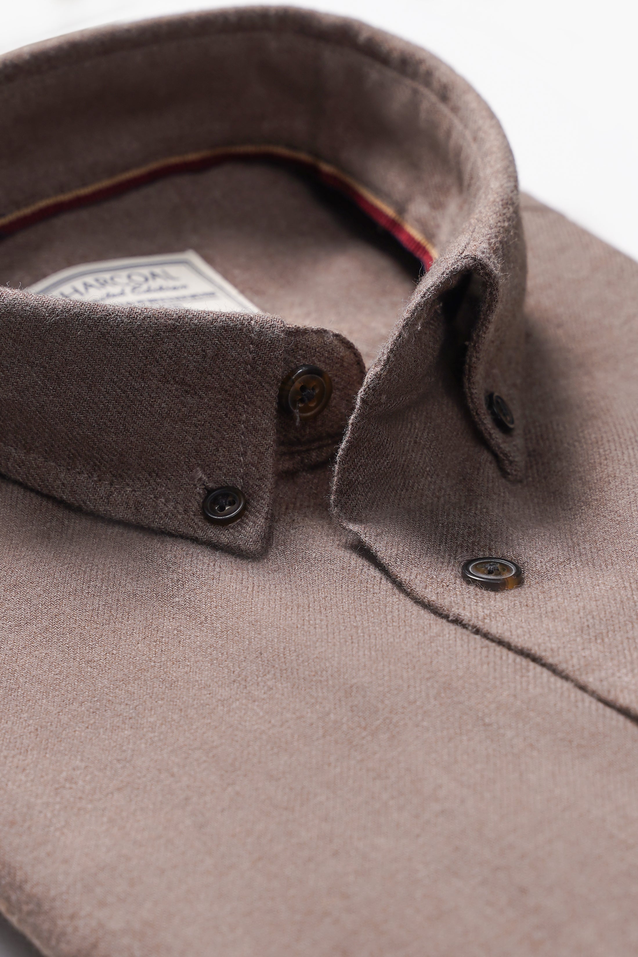 Charcoal wool shirt collar and placket detail, dark buttons