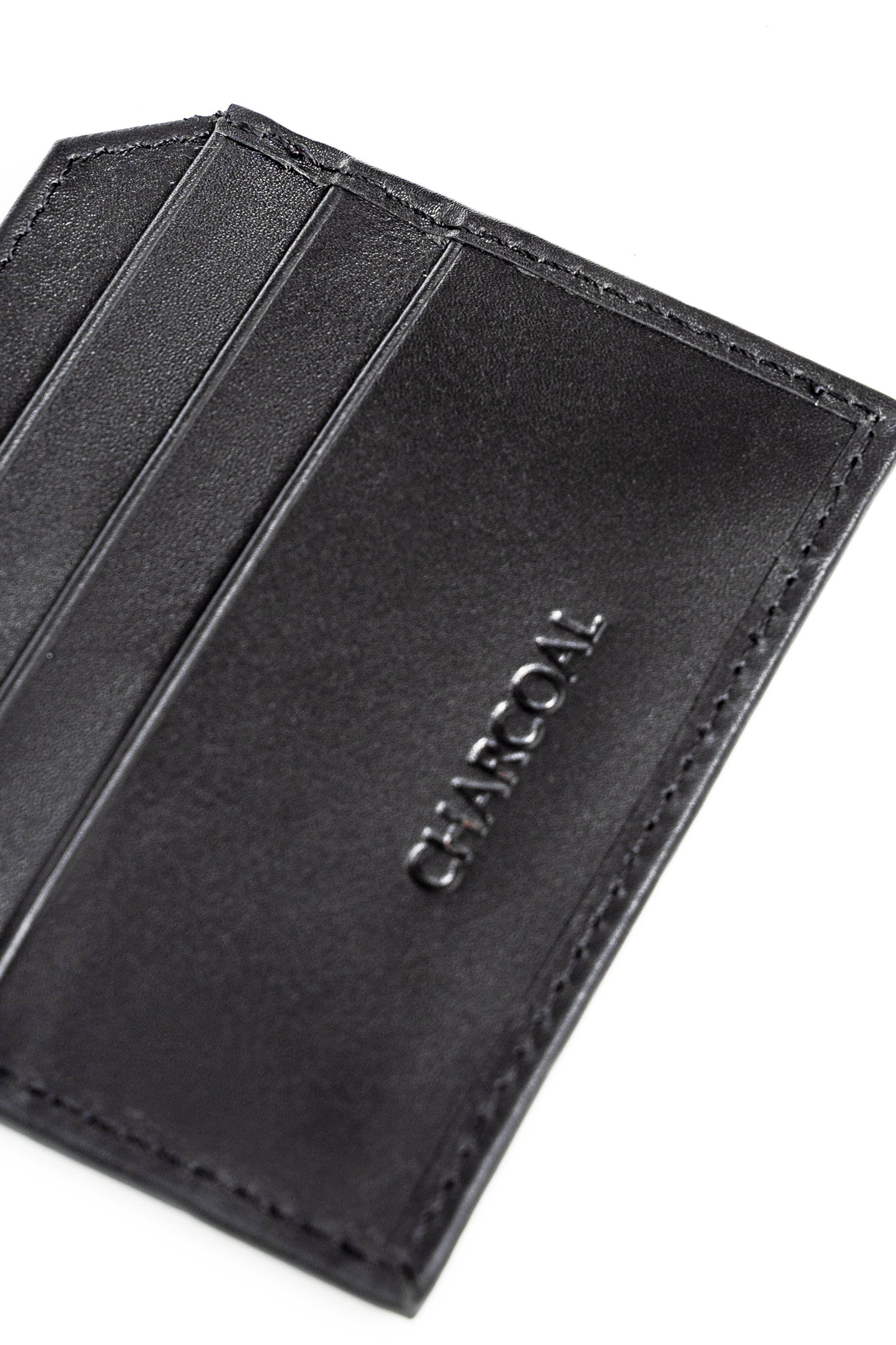 Charcoal wallet with embossed CHARCOAL logo and stitched edges, angled view