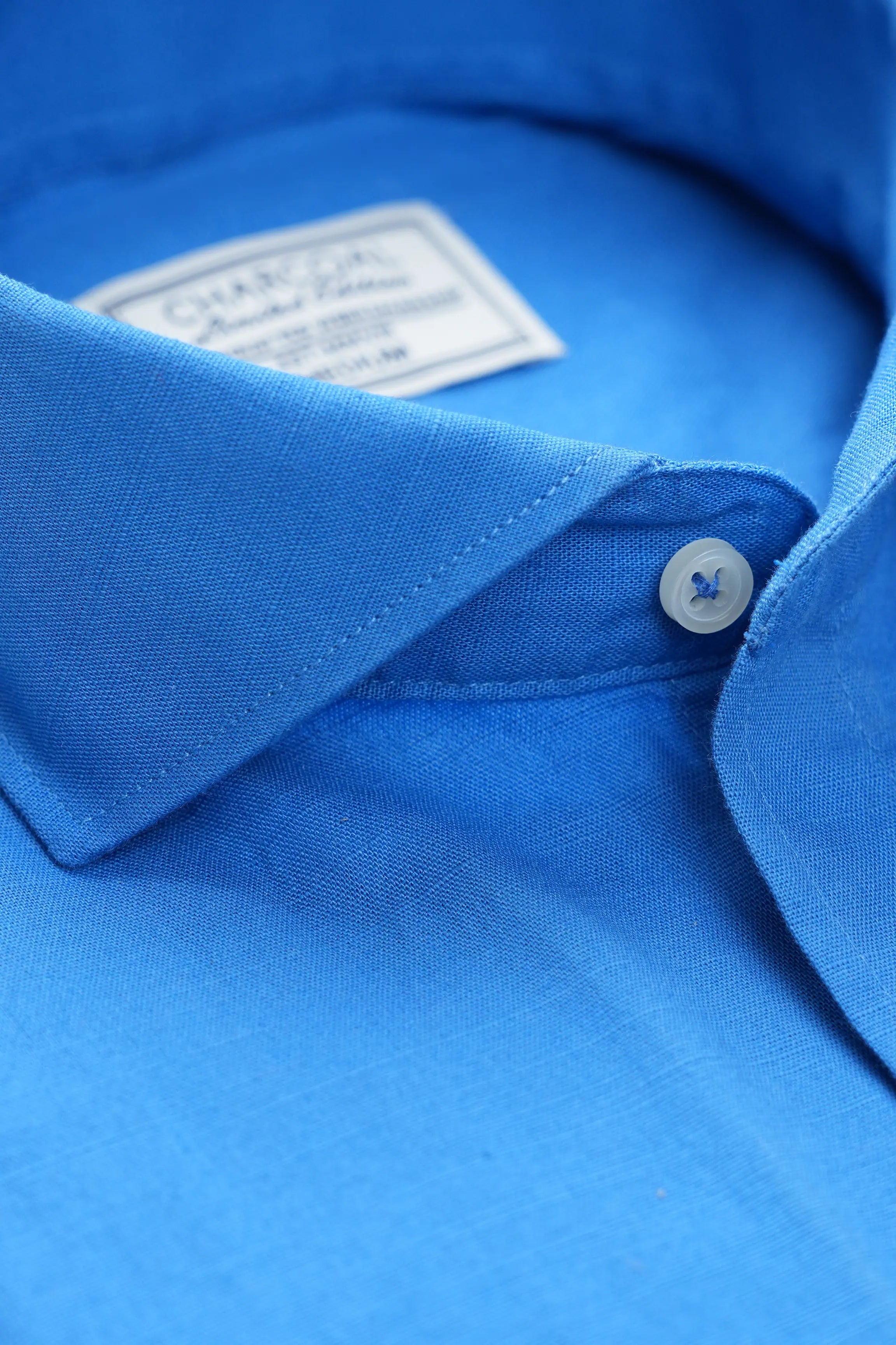 Blue linen wide spread collar neckline with button and inner label