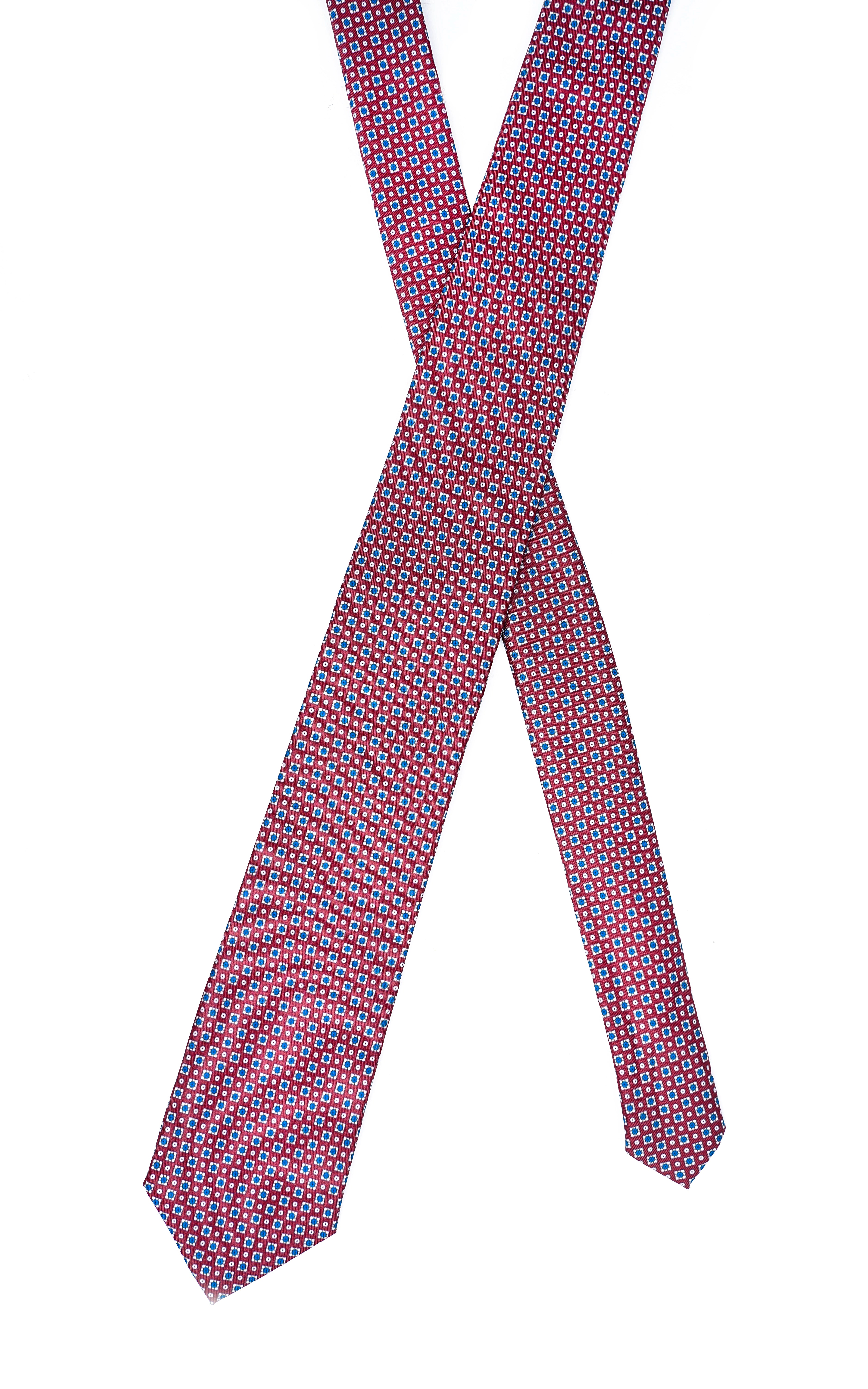 Poly-silk tie, knotted look with dark blue, red, and small light dot pattern