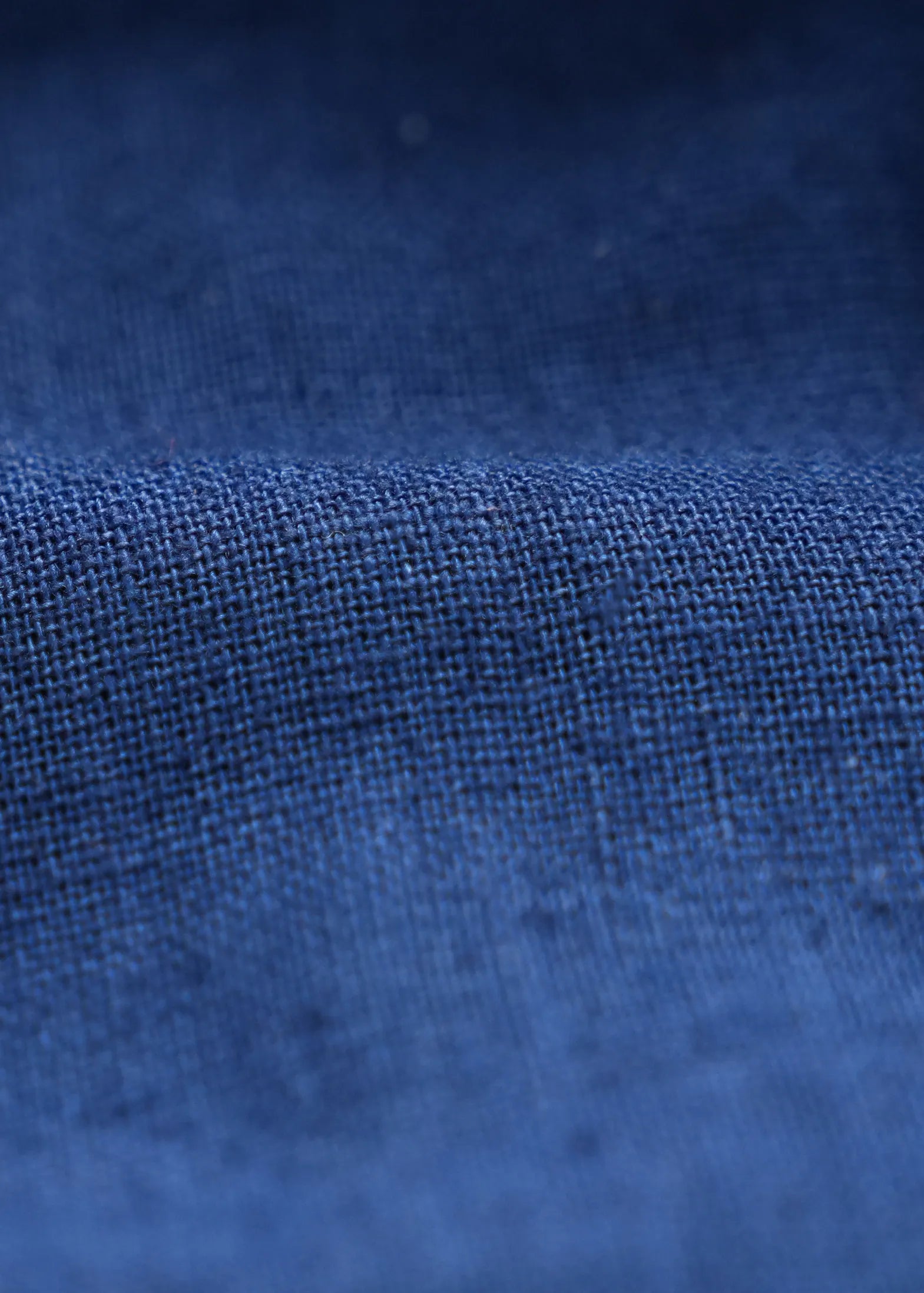Navy linen fabric close-up with textured weave